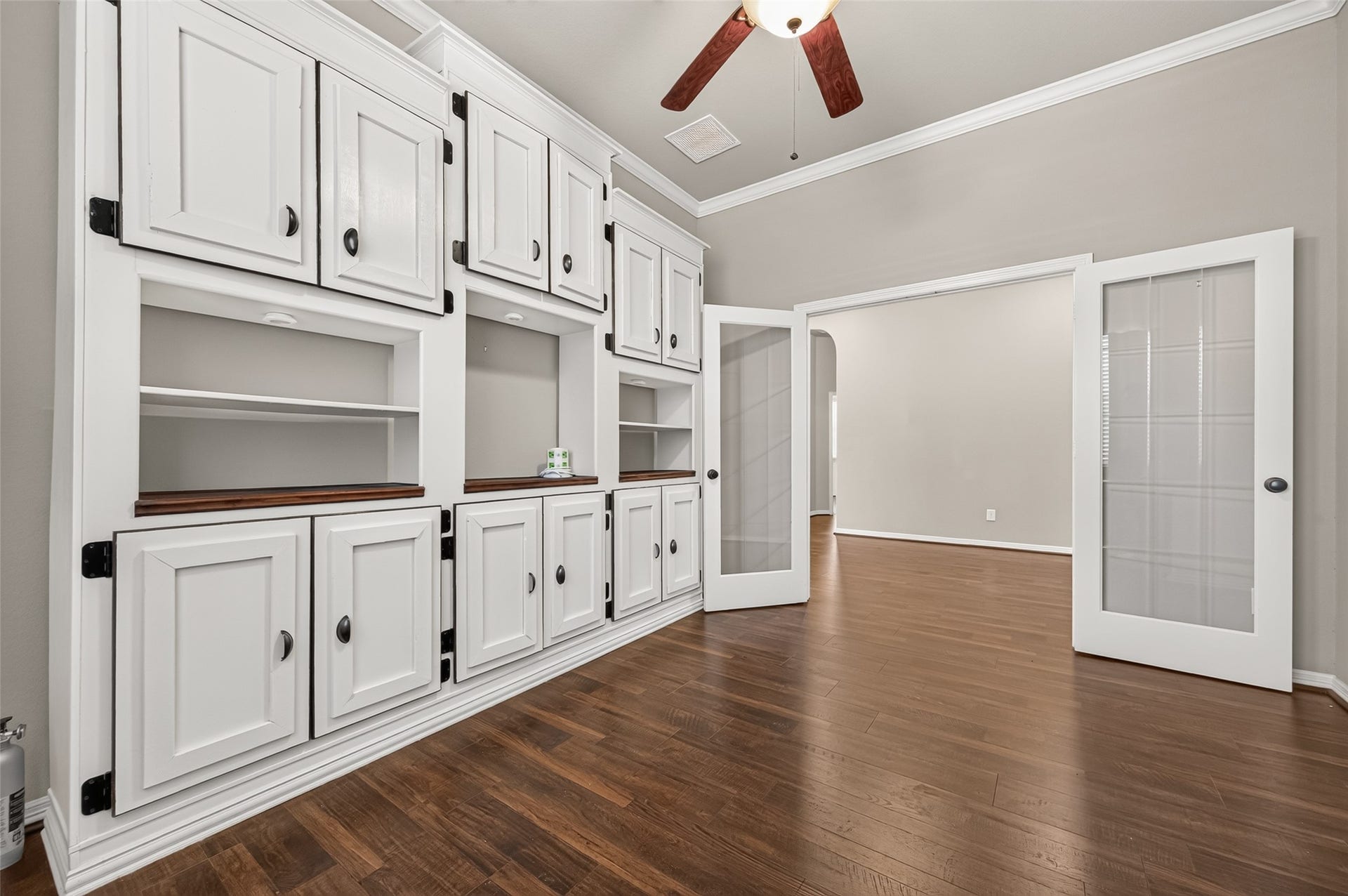 4314 Kent Ranch Court, Katy, TX 77494 Study with white built-ins and glass-paneled French doors.
