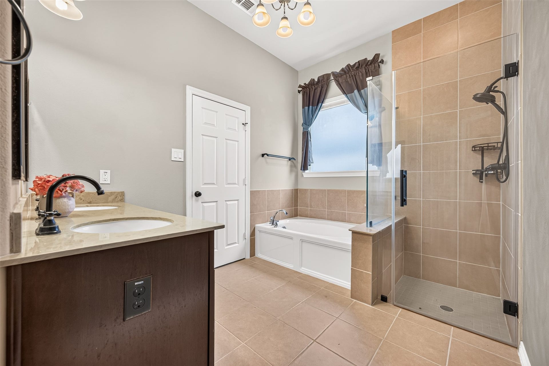 4314 Kent Ranch Court, Katy, TX 77494 Primary bath with garden tub, tiled walk-in shower with glass enclosure, and window.