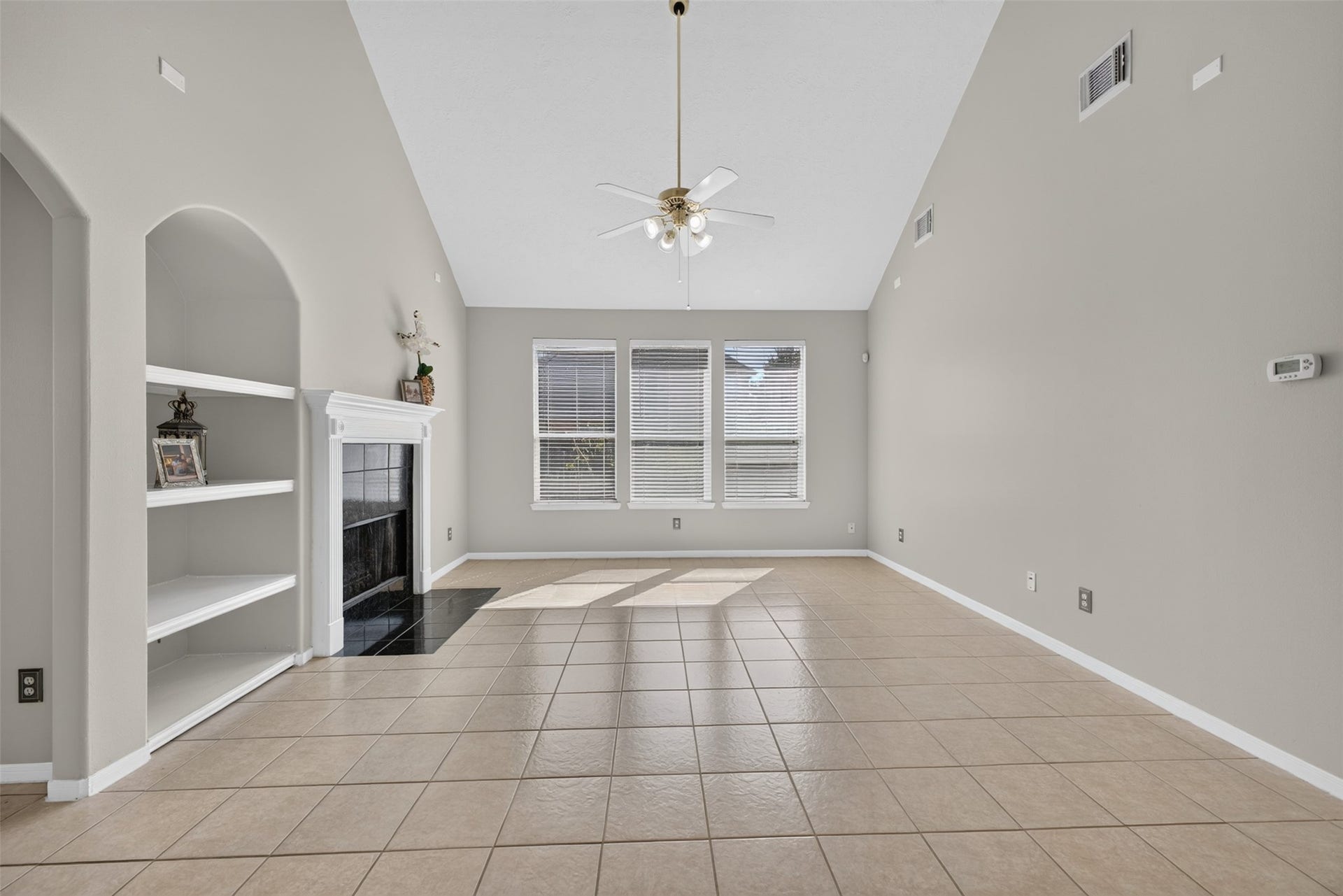 1011 Jasons Bend Drive, Sugar Land, TX 77479 Formal Living with built in shelves and fireplace