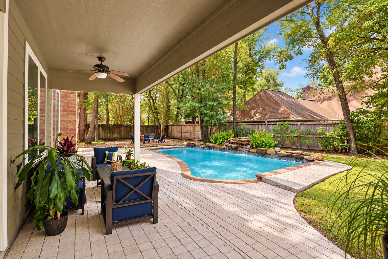 2713 N Logrun Circle, Spring, TX 77380 Morning coffee, afternoon swims or evenings with friendsthe expansive covered patio creates a comfortable outdoor living space overlooking the pool and backyard
