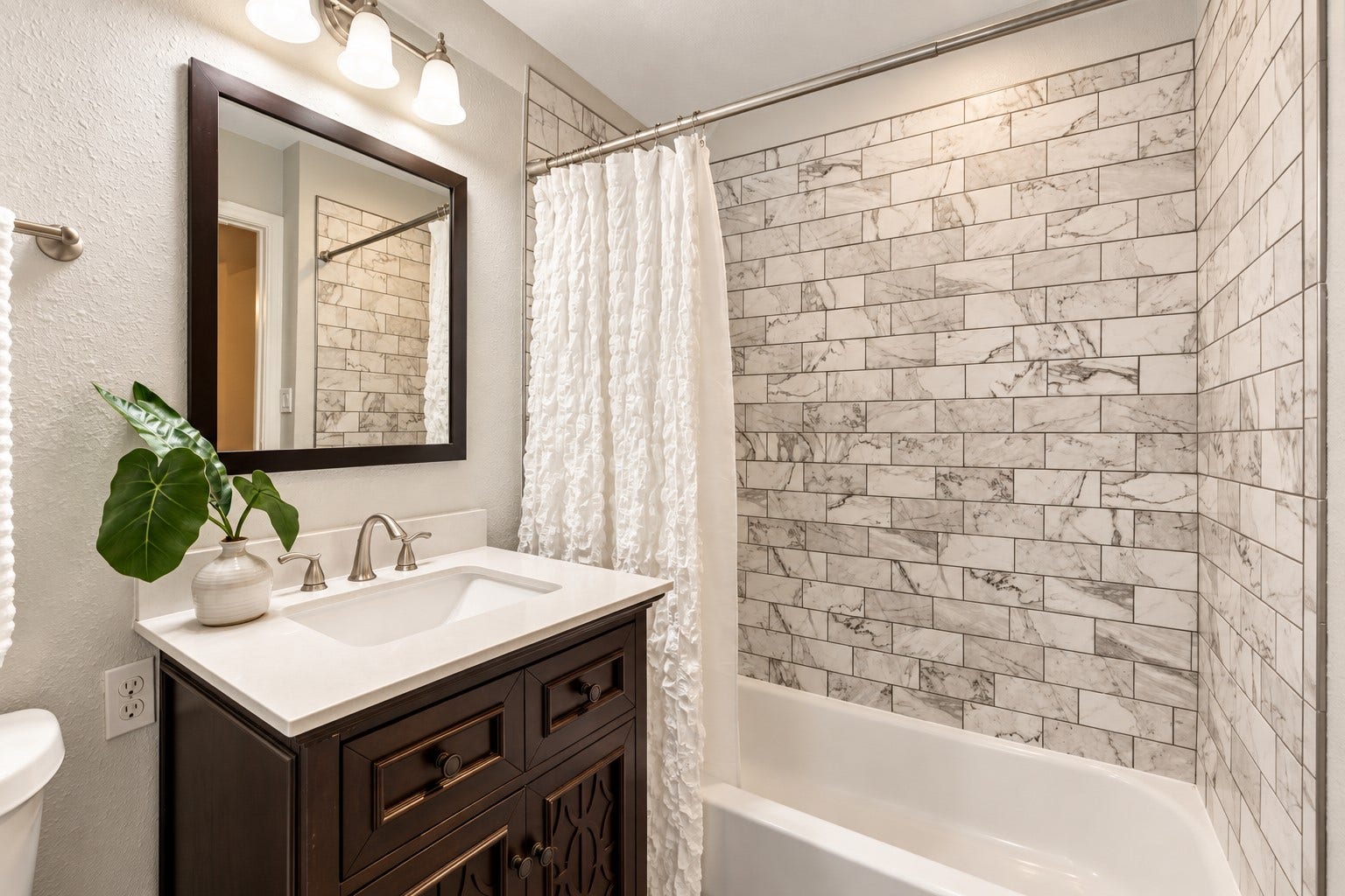 2713 N Logrun Circle, Spring, TX 77380 The private en suite bath features an updated dark wood vanity and tub/shower combination with custom tile surroundgiving this upstairs bedroom the comfort and privacy of its own suite.