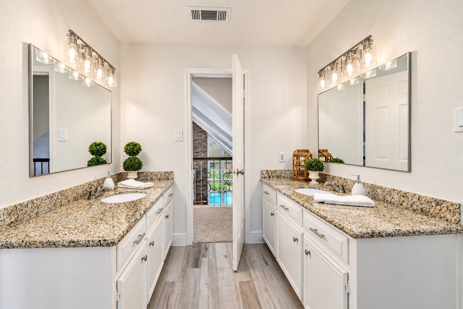 2713 N Logrun Circle, Spring, TX 77380 Designed with busy mornings in mind, the Jack-and-Jill bath gives each bedroom its own spacious vanity, sink & generous storage. Fresh neutral paint, updated lighting, mirrors & plumbing fixtures give the space a fresh, current feel.