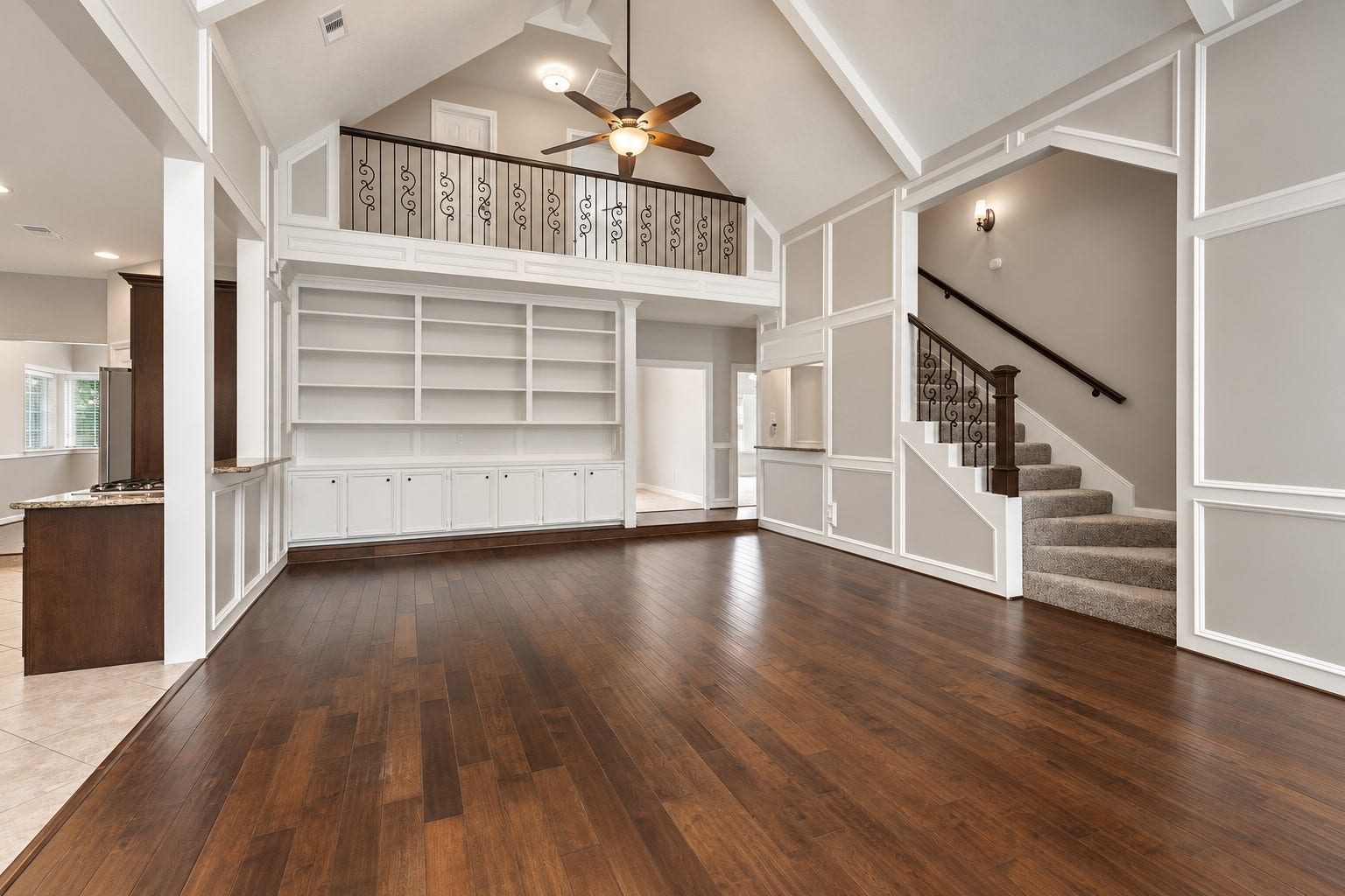 2713 N Logrun Circle, Spring, TX 77380 Shown unstaged. Notice the fabulous wrought iron balusters and custom built-ins. Impressive!