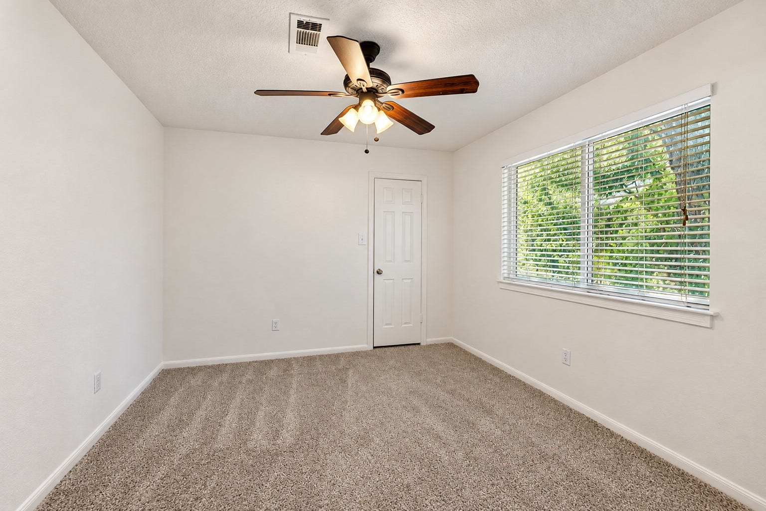 2713 N Logrun Circle, Spring, TX 77380 One of three upstairs bedrooms, this spacious secondary bedroom offers a large window, walk-in closet & its own private full bathan ideal setup for guests or an older child.