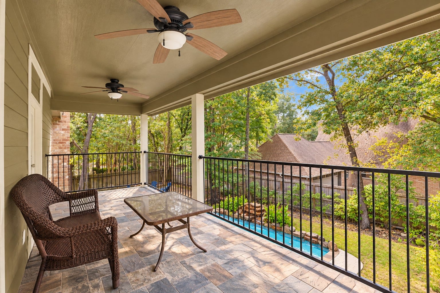 2713 N Logrun Circle, Spring, TX 77380 The covered upstairs balcony overlooks the pool and wooded backyard, creating a peaceful extension of the Game Room and Bonus Room living spaces