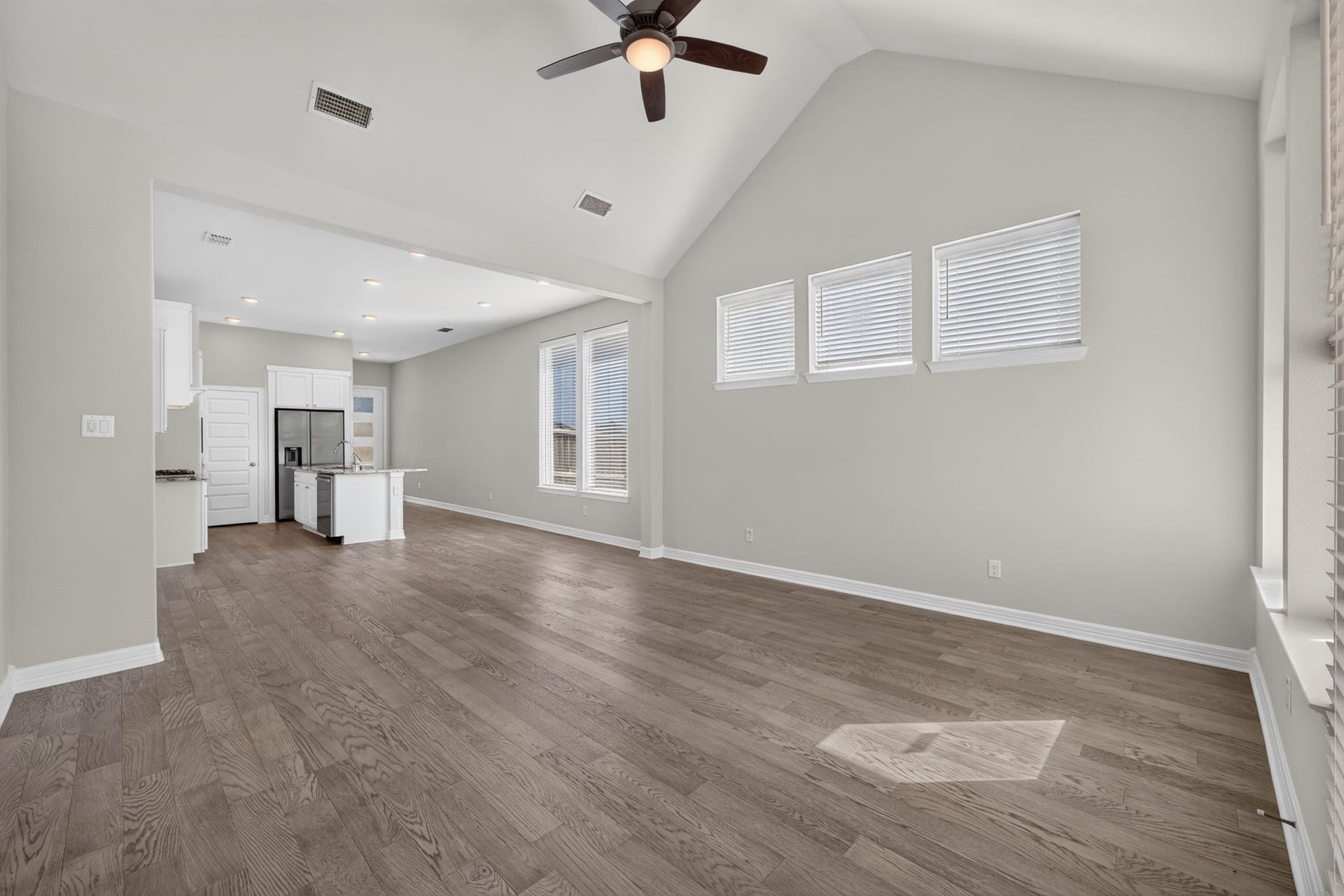 24638 Carleton Lake Lane, Tomball, TX 77375 Family room has 3 higher windows on main wall allowing natural lighting and ample wall space for furniture placement below.