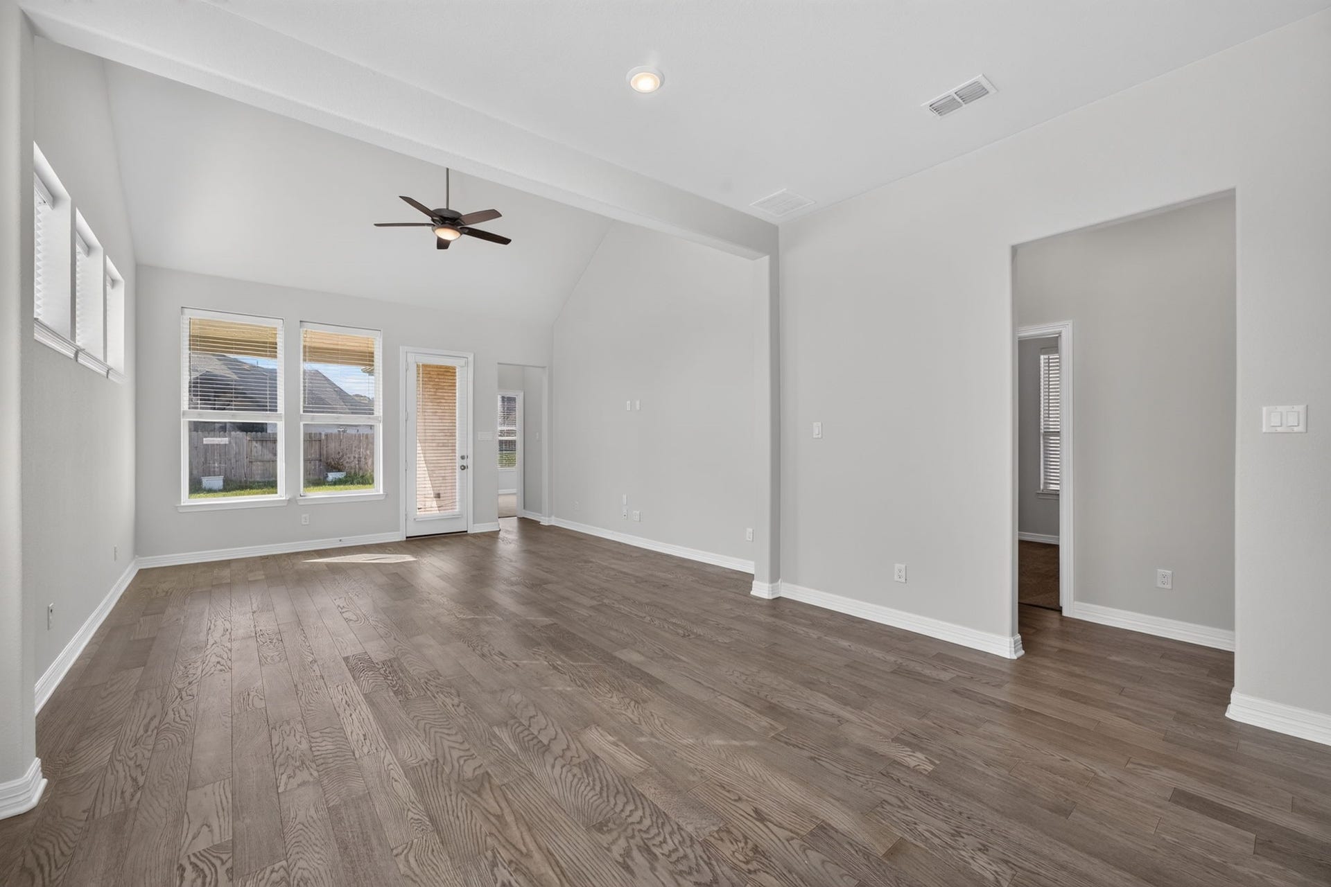 24638 Carleton Lake Lane, Tomball, TX 77375 Gorgeous wood floors compliment the light gray walls in family room. Large windows overlook back yard and lanai with convenient access door.