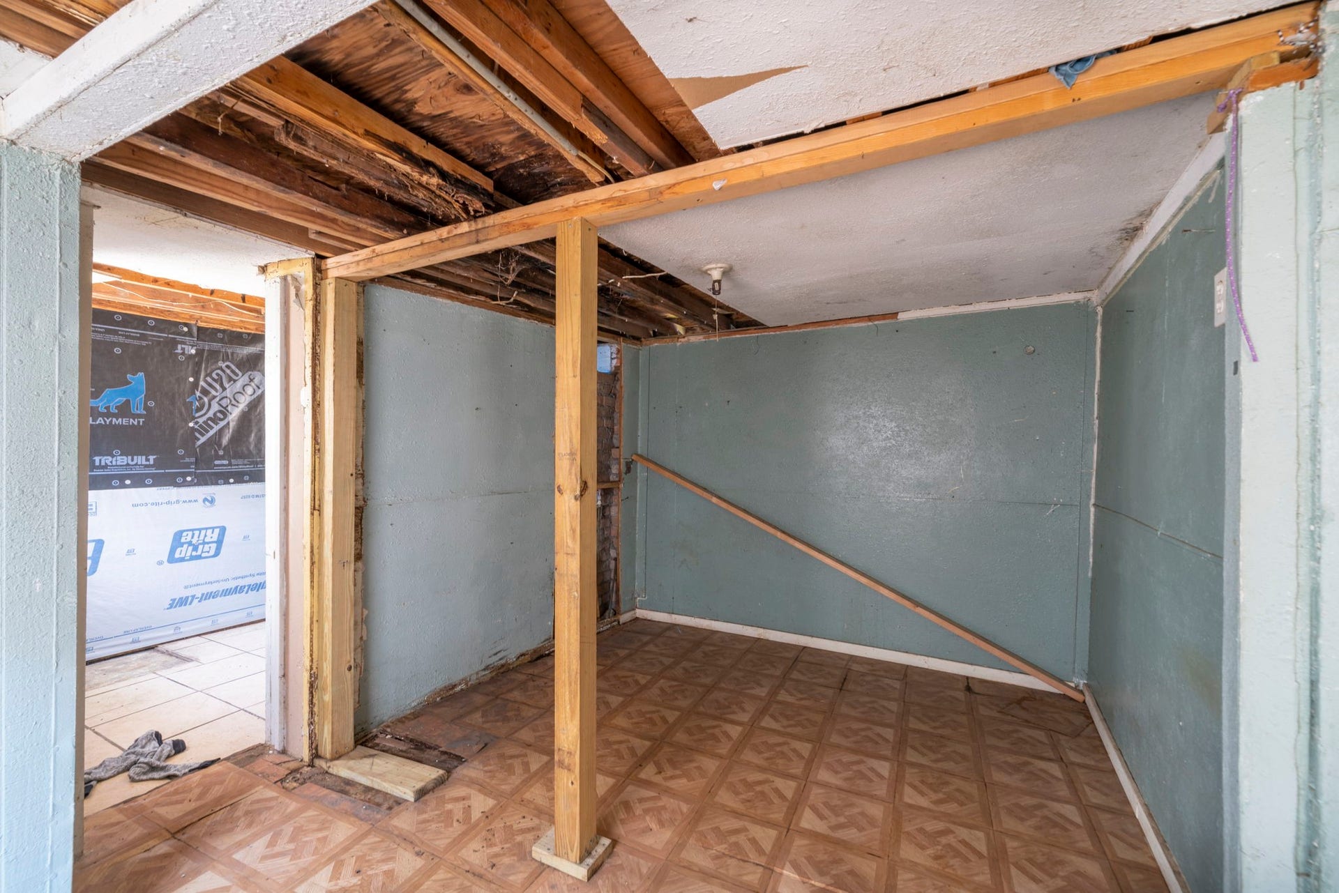 Flexible lower-level room with staircase access.