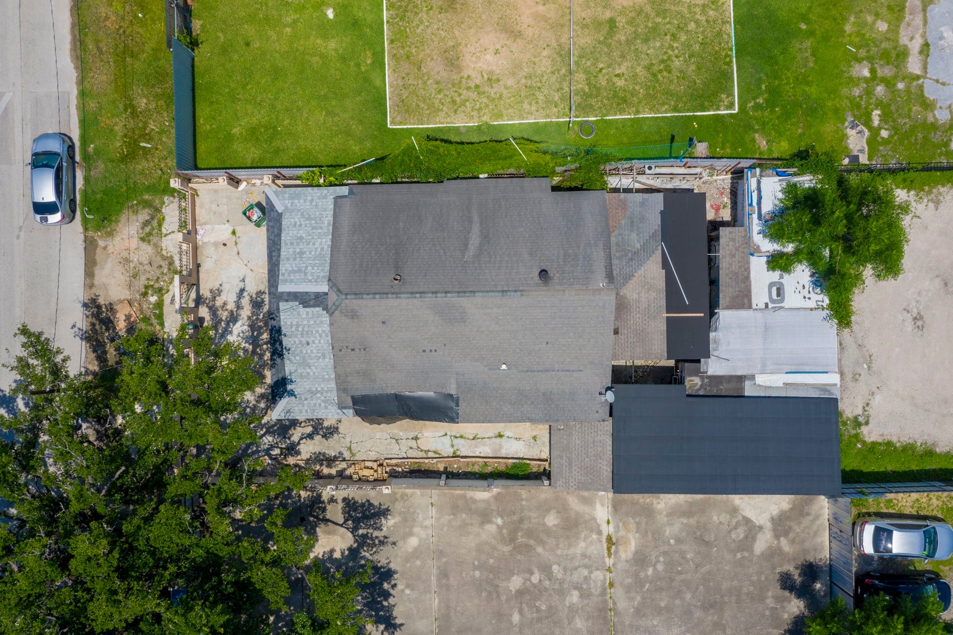 Overhead view showing the existing buildings and site access.