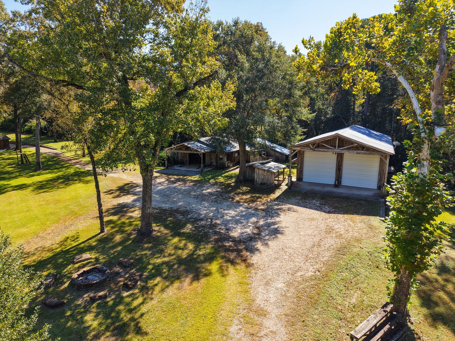 23107 Kobs Road, Tomball, TX 77377 Aerial of the RV barn with two roll up doors complete with a tack room and bathroom.