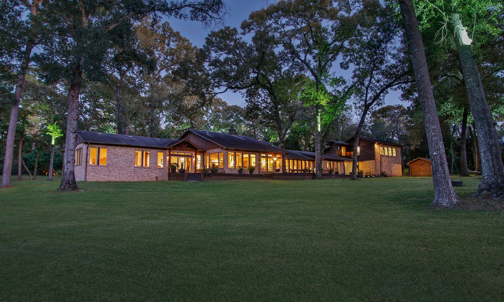 23107 Kobs Road, Tomball, TX 77377 Another view of the sprawling house in the evening! Simply breathtaking.