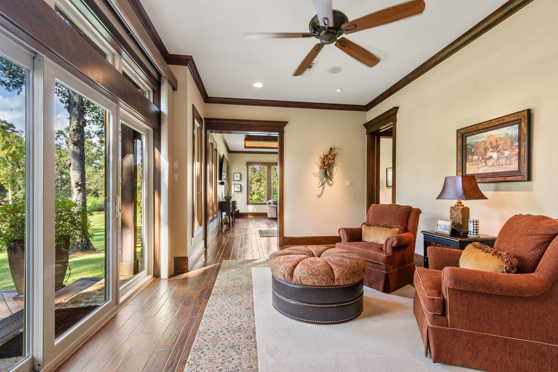 23107 Kobs Road, Tomball, TX 77377 Discover the inviting sitting area of this luxurious primary suite, perfect for relaxing with a book or enjoying a morning coffee, enhanced by the stunning view.