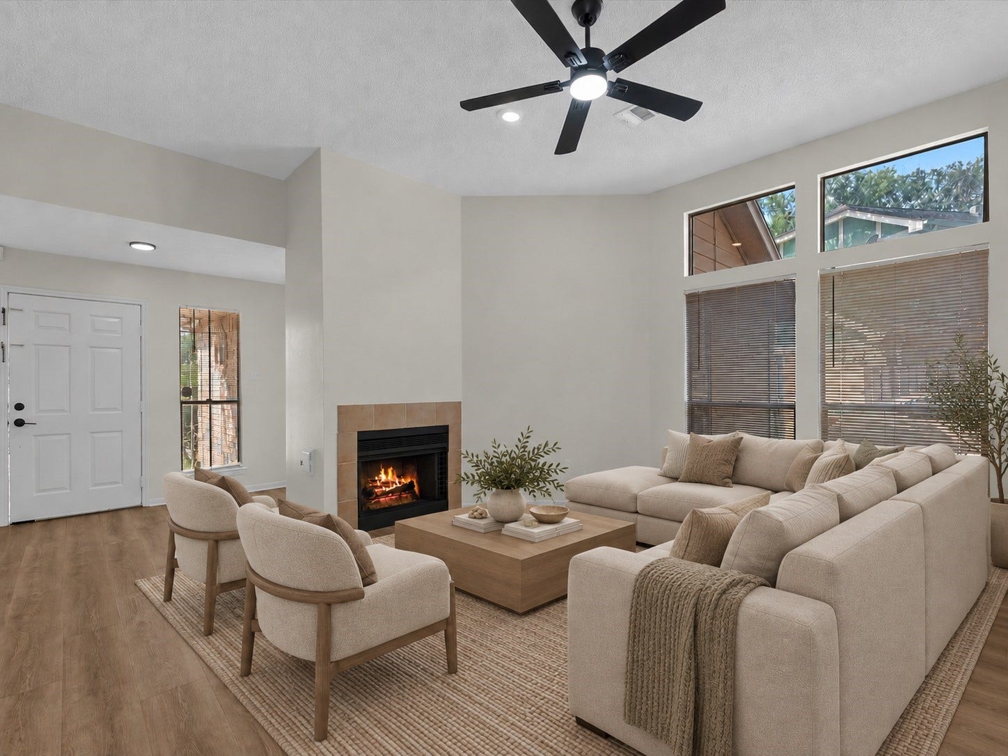 6338 Southwood Court N, Houston, TX 77035 Living room with view of fireplace, large windows for natural lighting. * virtually staged to show potential