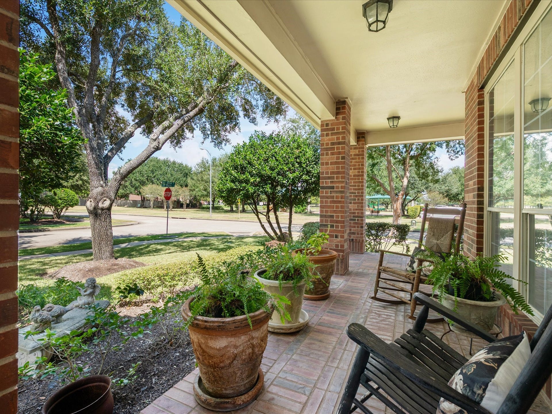 1834 Lake Quitman Drive, Richmond, TX 77406 The perfect spot for morning coffee or evening sunsets, this inviting porch overlooks the tree lined street with cozy rocking chairs to sit back and relax.