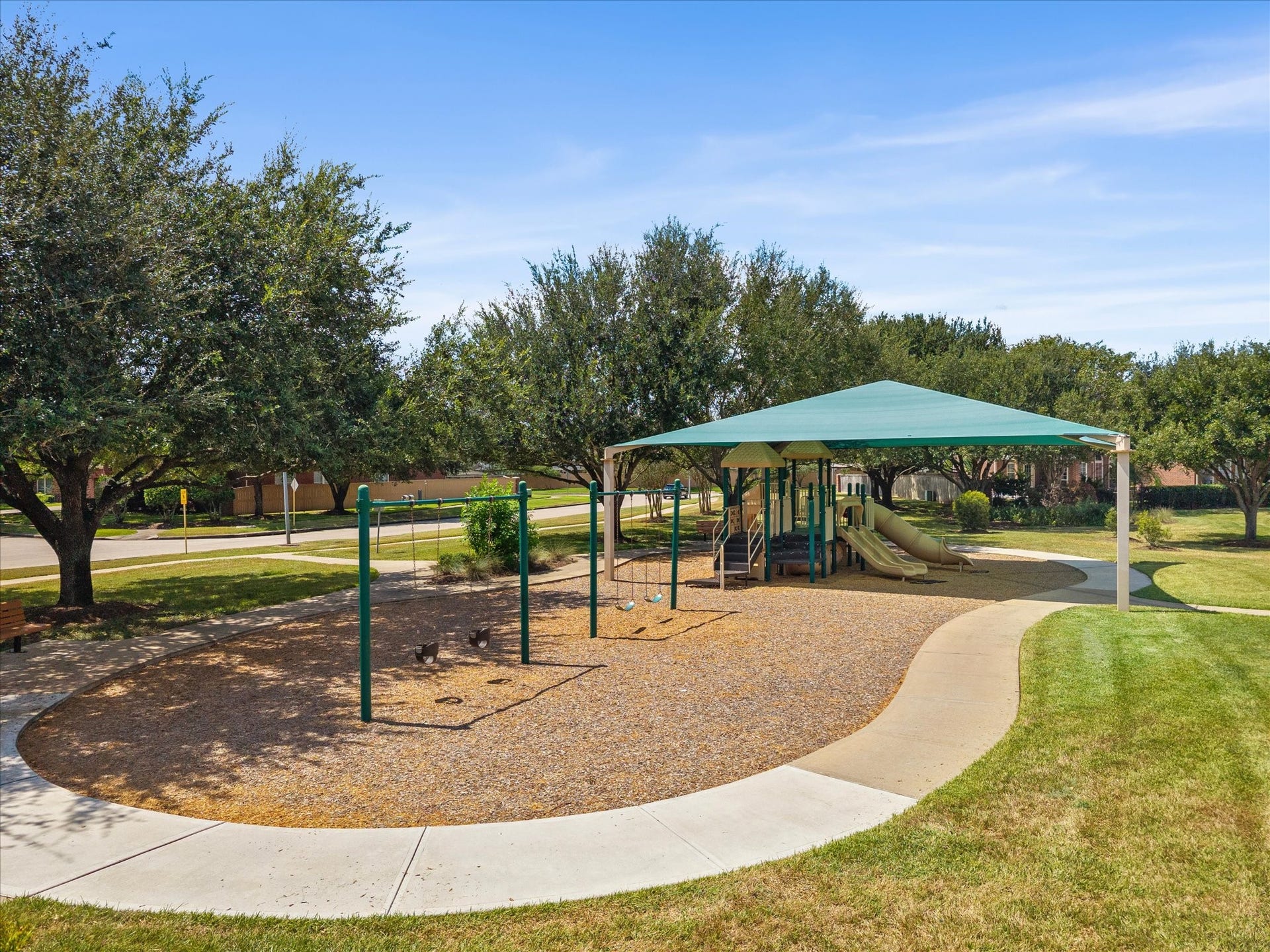 1834 Lake Quitman Drive, Richmond, TX 77406 Neighborhood playground with a shaded play structure, swings, and walking paths, a short stroll from home and perfect for families.