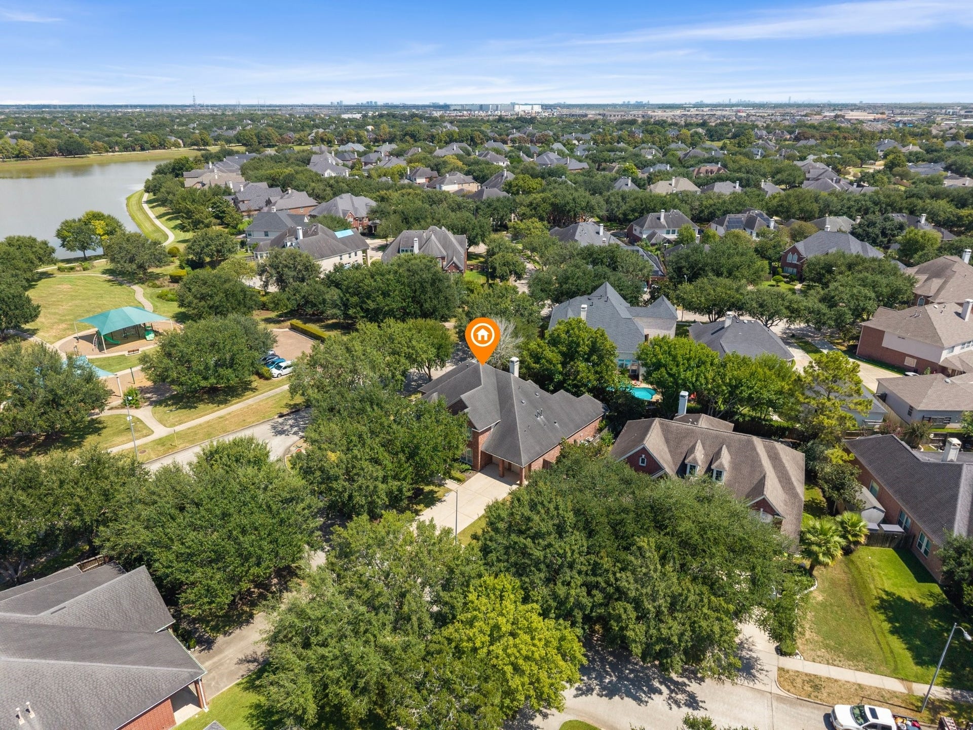 1834 Lake Quitman Drive, Richmond, TX 77406 Another aerial vantage point marking the home's spot in the neighborhood, close to the community playground, park, and Figure Four Lake in the distance.