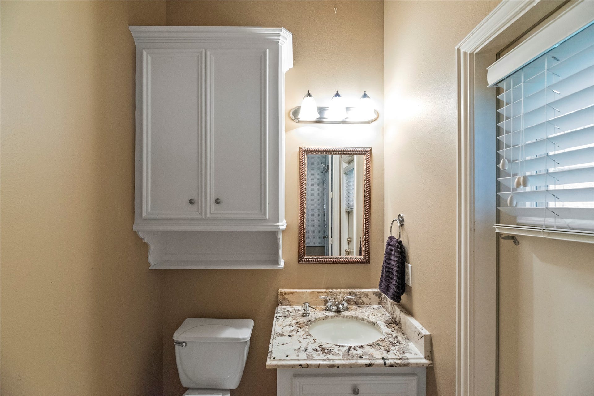 13915 Springmint Drive, Cypress, TX 77429 Convenient half bathroom off the garage near the back patio.