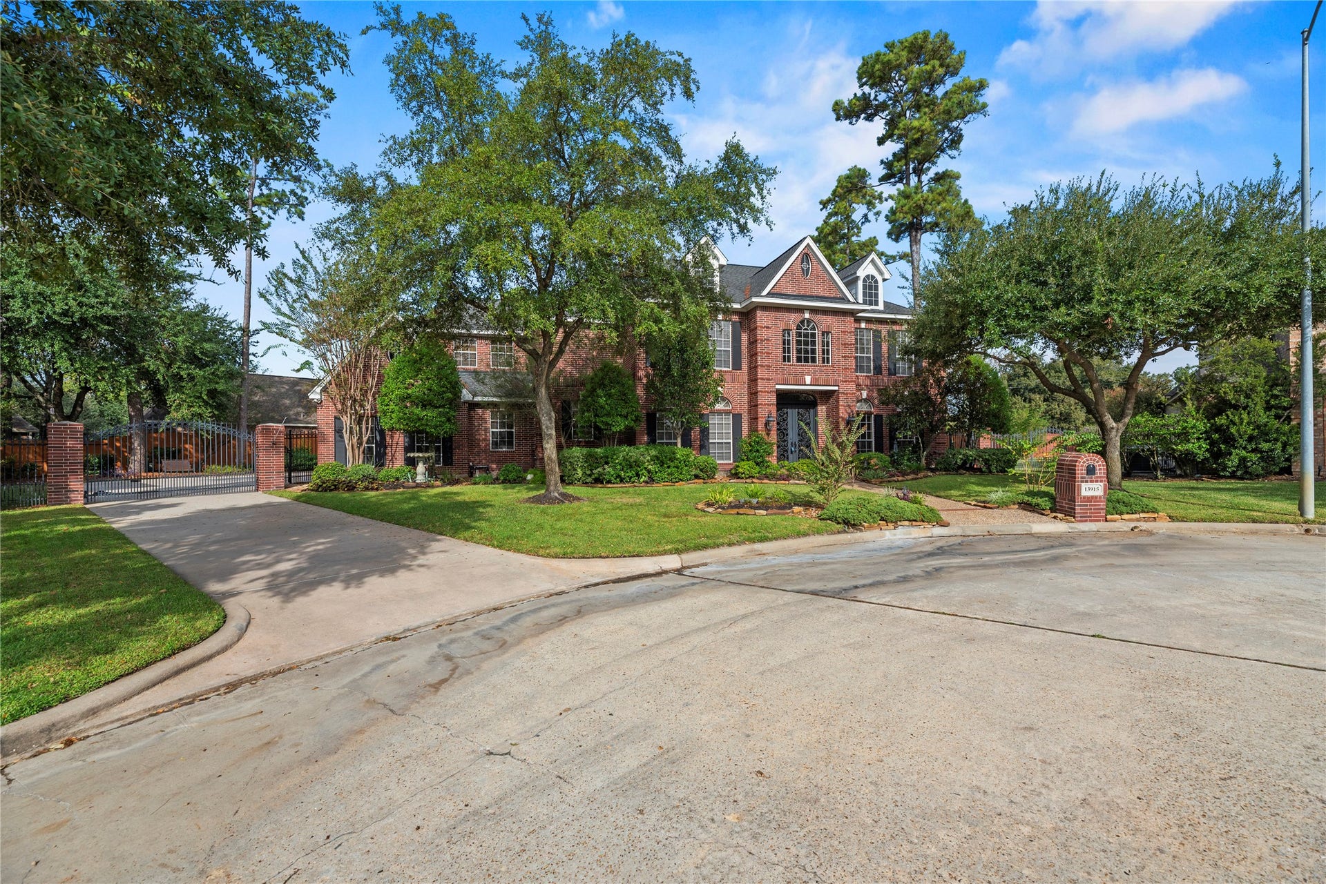 13915 Springmint Drive, Cypress, TX 77429 Huge lot with a gated driveway leading to an attached 3-car garage.