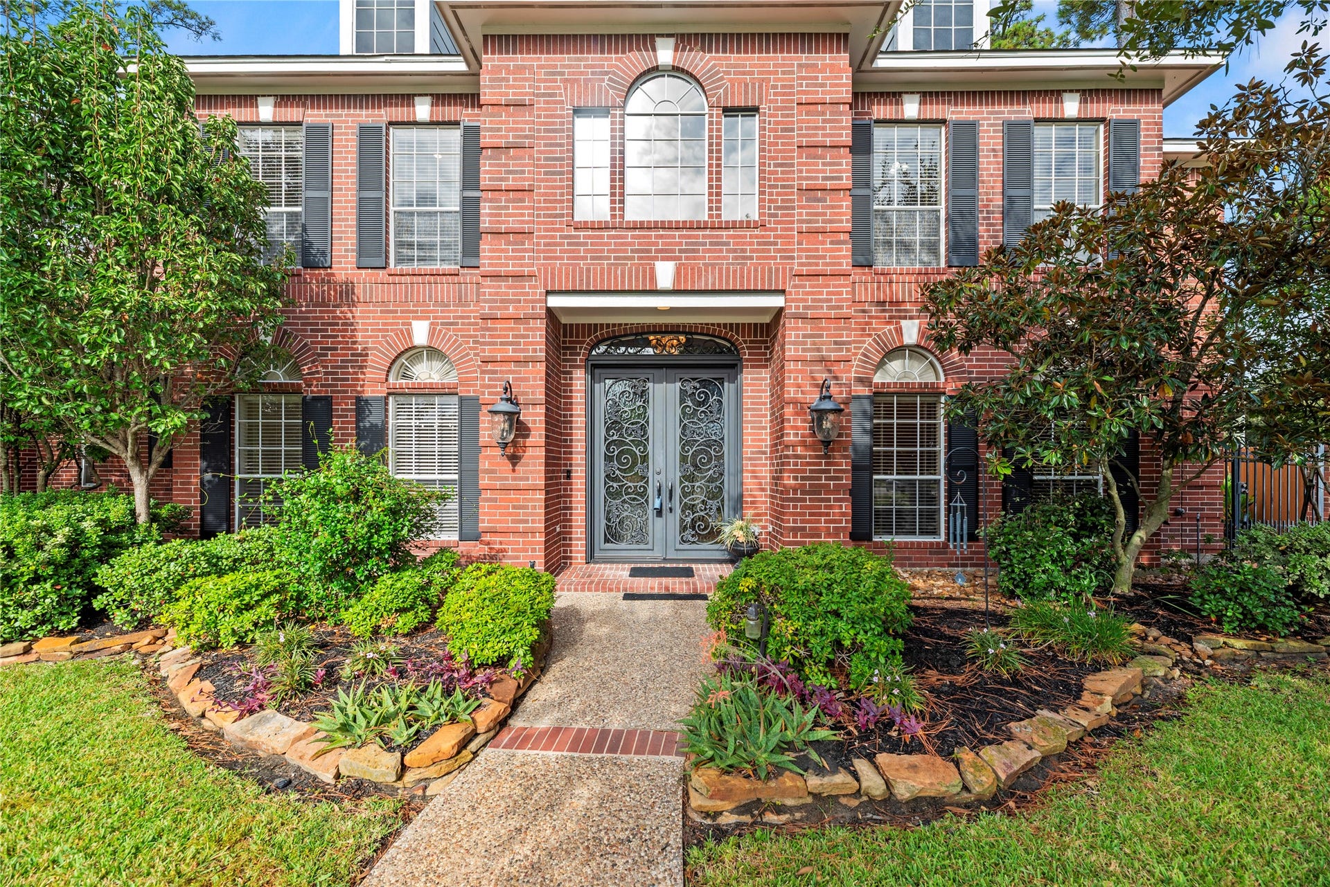13915 Springmint Drive, Cypress, TX 77429 Stately 2-story home with a gorgeous brick elevation and lush landscaping.