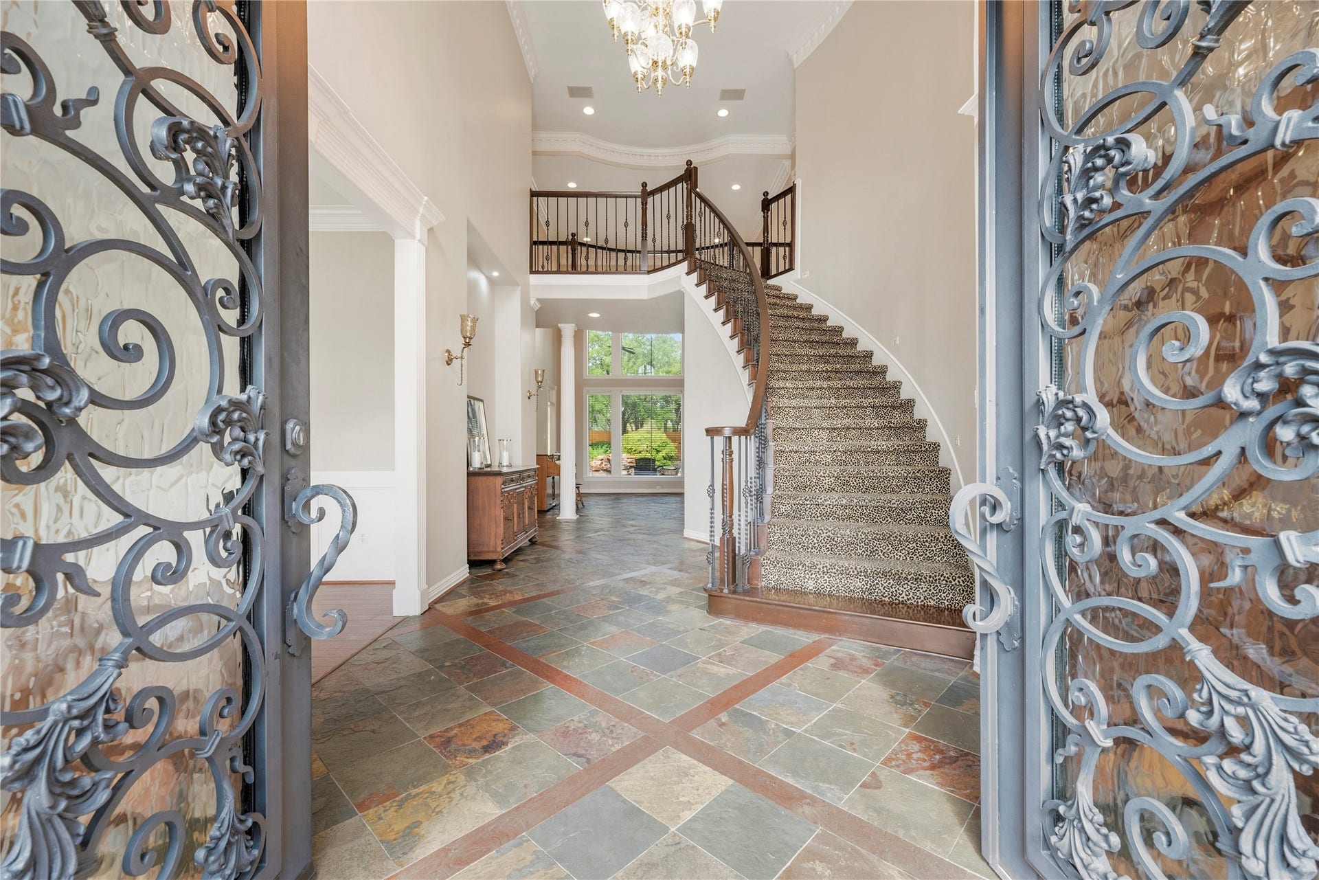 13915 Springmint Drive, Cypress, TX 77429 Stunning wrought iron double doors open to a grand foyer.