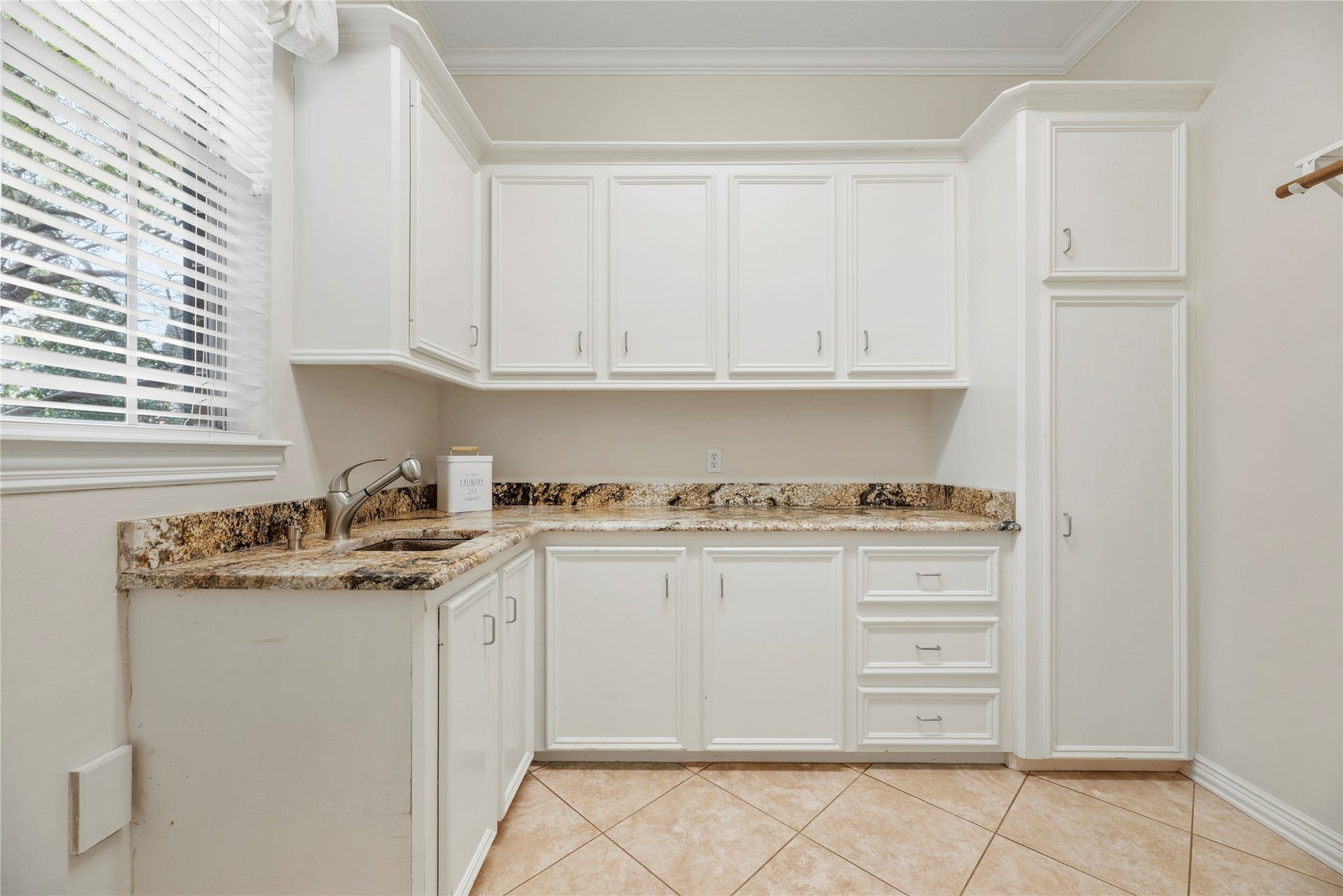 13915 Springmint Drive, Cypress, TX 77429 Downstairs utility room has a sink and additional storage.