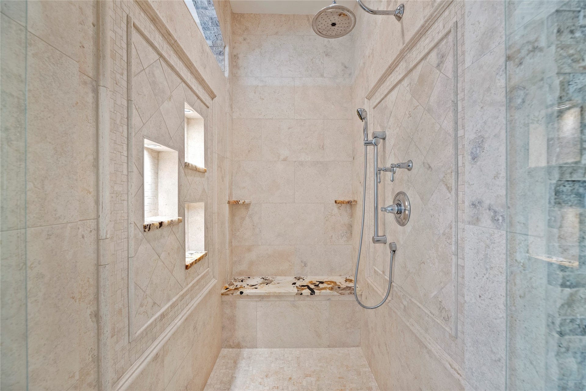 13915 Springmint Drive, Cypress, TX 77429 Walk-in shower with lighted niches and a bench.