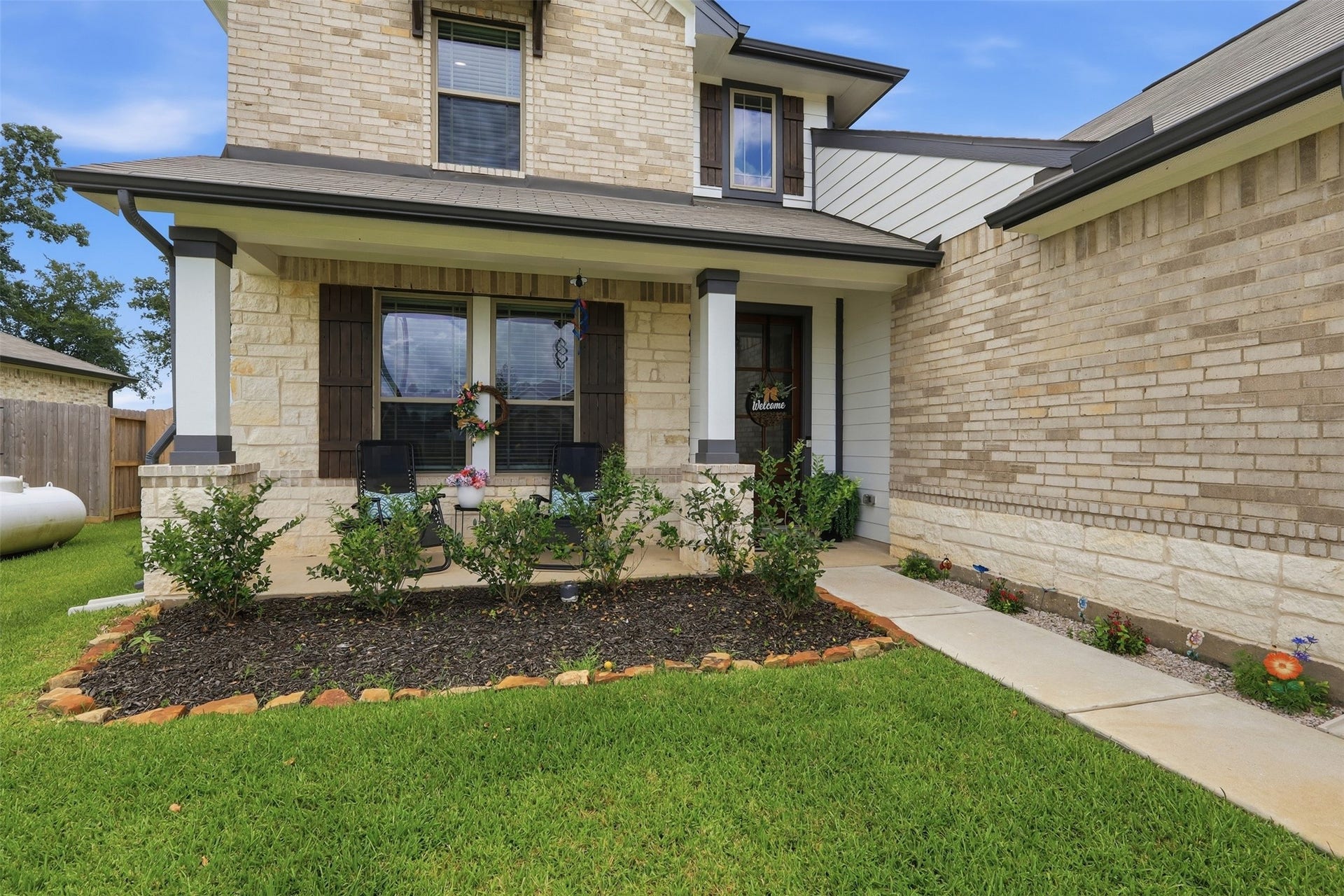 Relax and unwind on the charming covered front porch, perfect for enjoying your morning coffee or evening sunsets.