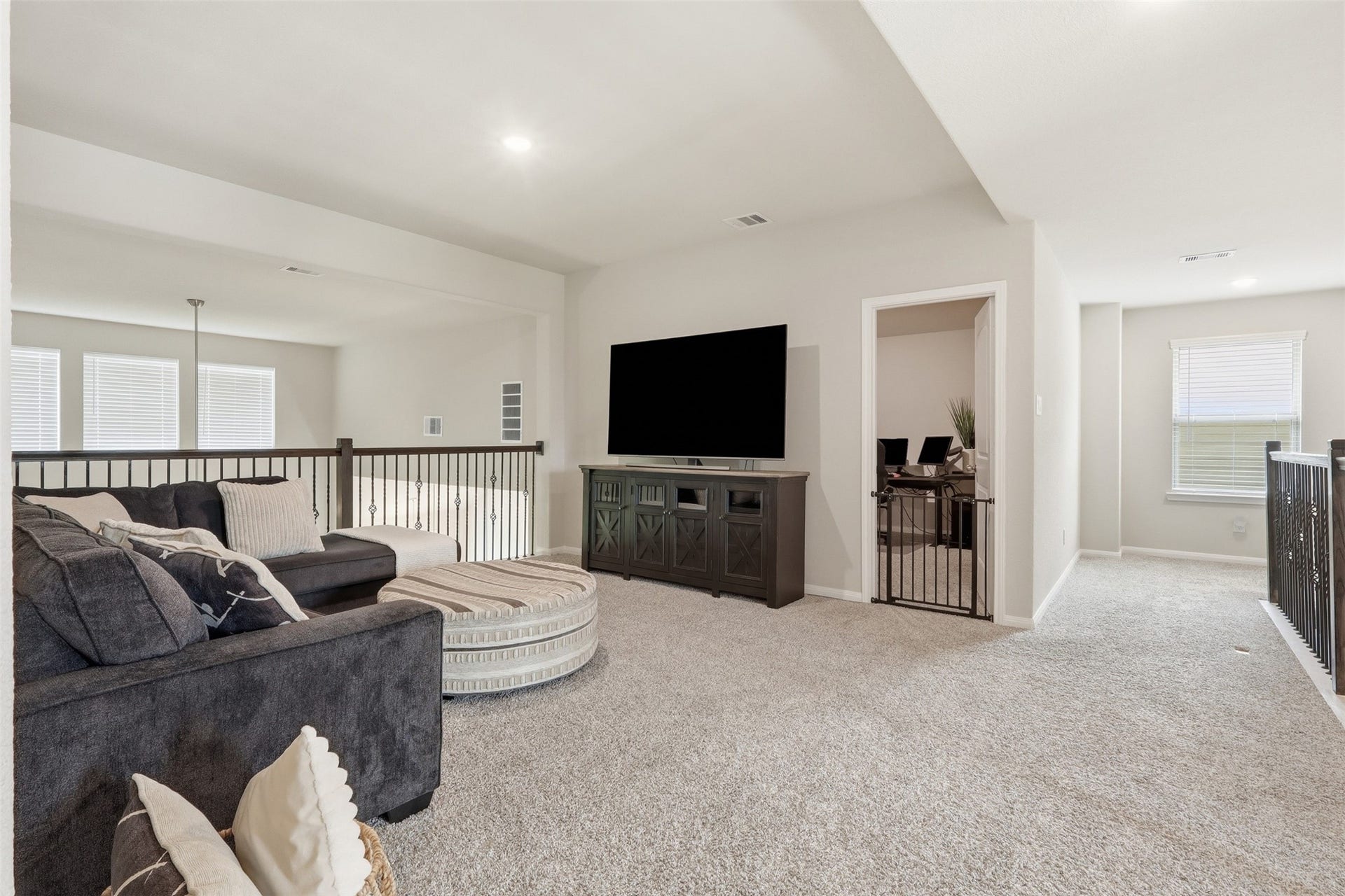 Centrally located game room adjacent to the media room and upstairs bedrooms, creating the perfect space for entertainment and family gatherings.