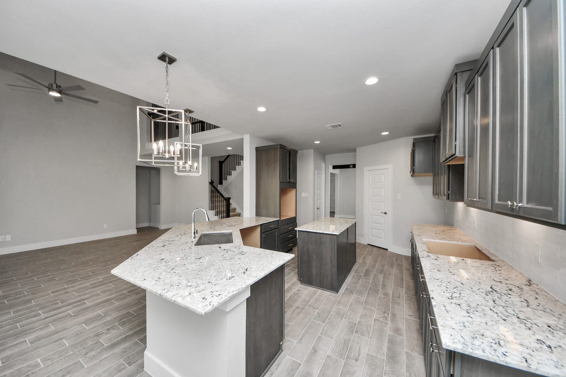 3213 Skerne Spring Drive, Spring, TX 77373 All of this overlooks your expansive family room, creating a perfect space for culinary delights and family gatherings. Sample photo of completed home with similar floor plan. Actual colors and selections may vary.