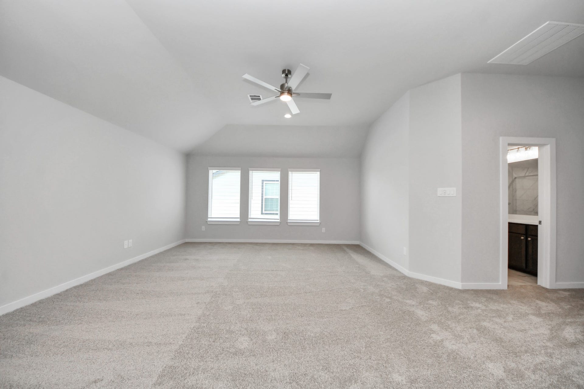3213 Skerne Spring Drive, Spring, TX 77373 Come upstairs and enjoy a day of leisure in this fabulous game room! This is the perfect hangout spot or adult game room! Features plush carpet, high ceilings, custom paint and windows for plenty of natural light. Sample photo of completed home with similar floor plan. Actual colors and selections may vary.