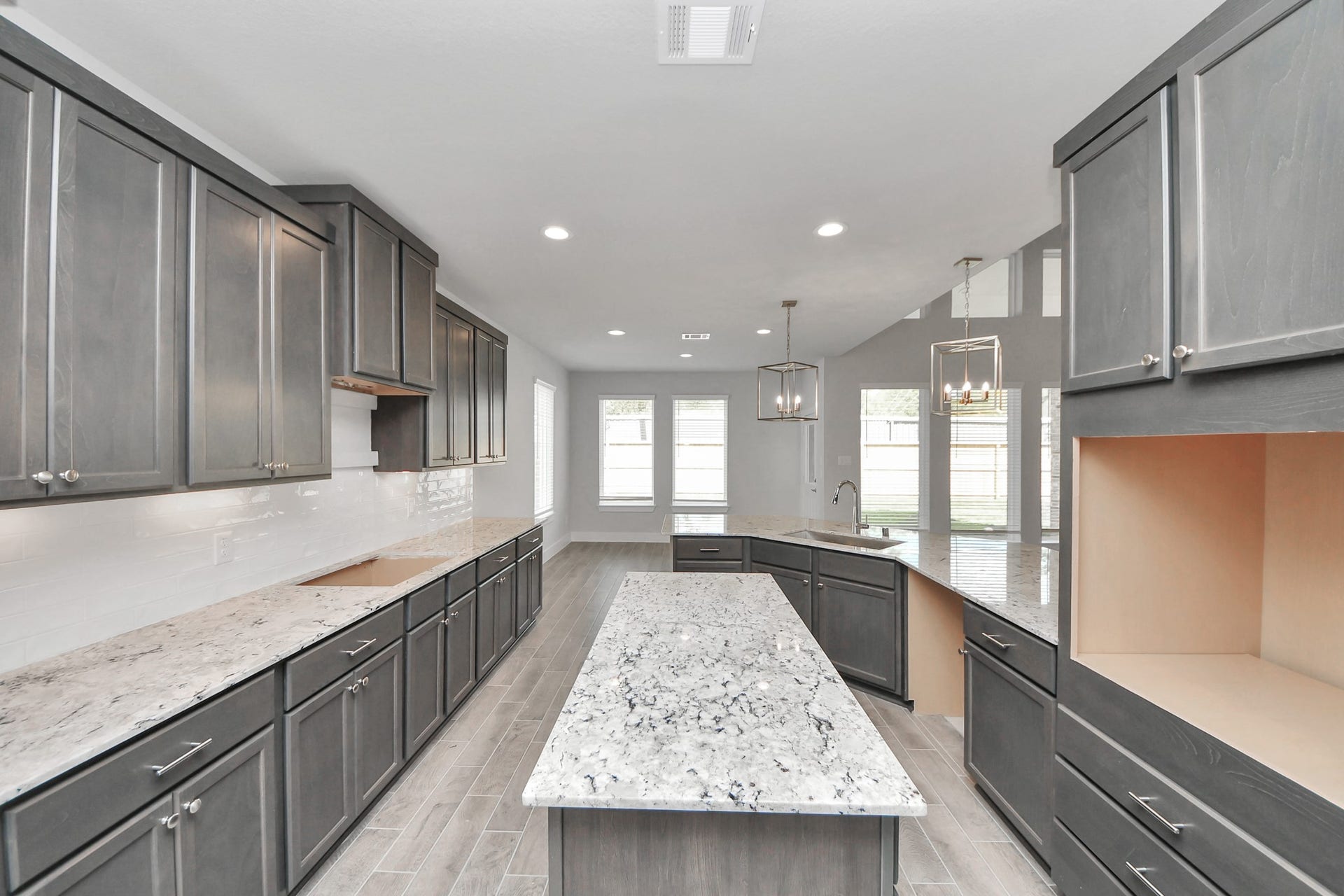 3213 Skerne Spring Drive, Spring, TX 77373 The kitchen is a culinary haven, featuring granite countertops, a tile backsplash, stainless steel appliances, 42 upper cabinets, and undercabinet lighting. Sample photo of completed home with similar floor plan. Actual colors and selections may vary.
