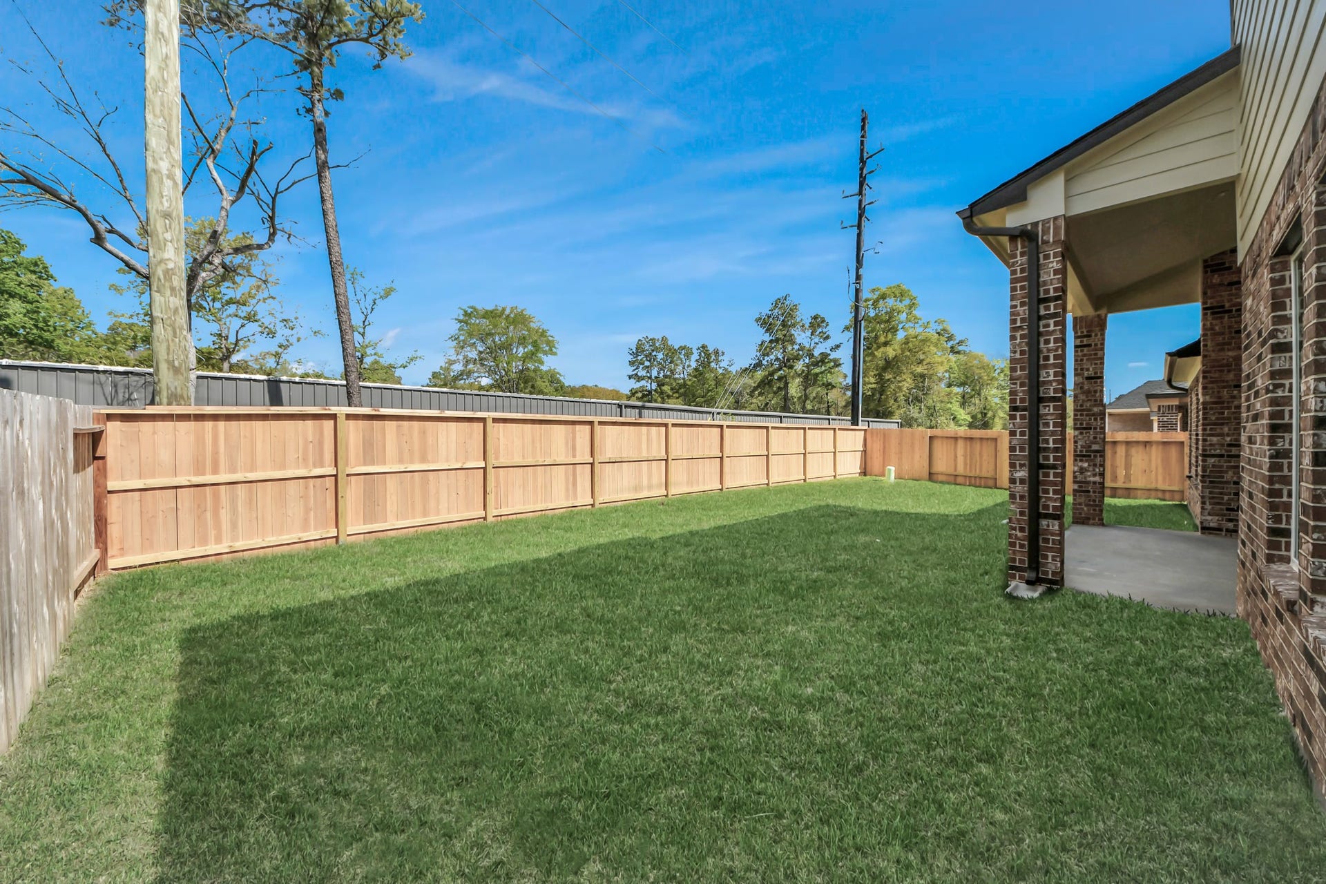 3213 Skerne Spring Drive, Spring, TX 77373 Experience outdoor living at its finest on this expansive covered patio, thoughtfully designed for BBQs and delightful outdoor dining. Sample photo of completed home with similar floor plan. Actual colors and selections may vary.