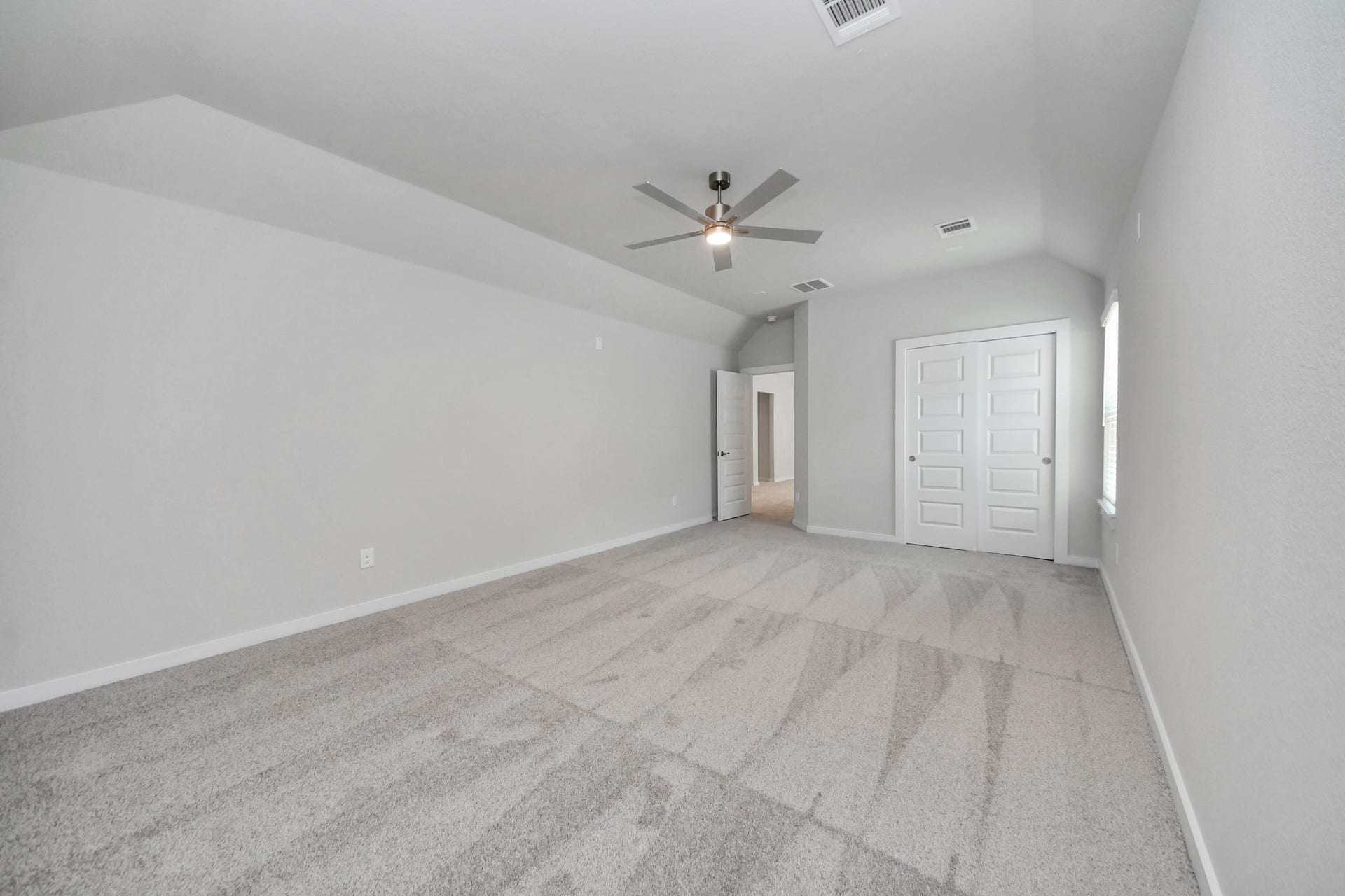 3213 Skerne Spring Drive, Spring, TX 77373 Generously sized secondary bedrooms featuring spacious closets, soft and inviting carpeting underfoot, large windows allowing plenty of natural light, and the added touch of privacy blinds for your personal retreat. Sample photo of completed home with similar floor plan. Actual colors and selections may vary.