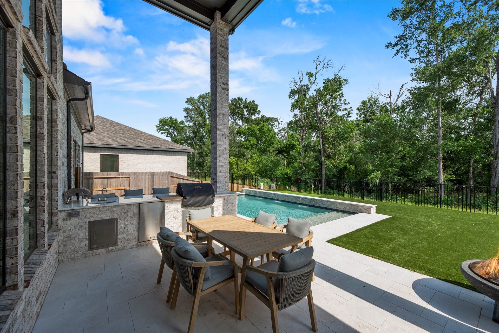 4439 Southpoint Way, Fulshear, TX 77441 Outdoor kitchen and covered patio.