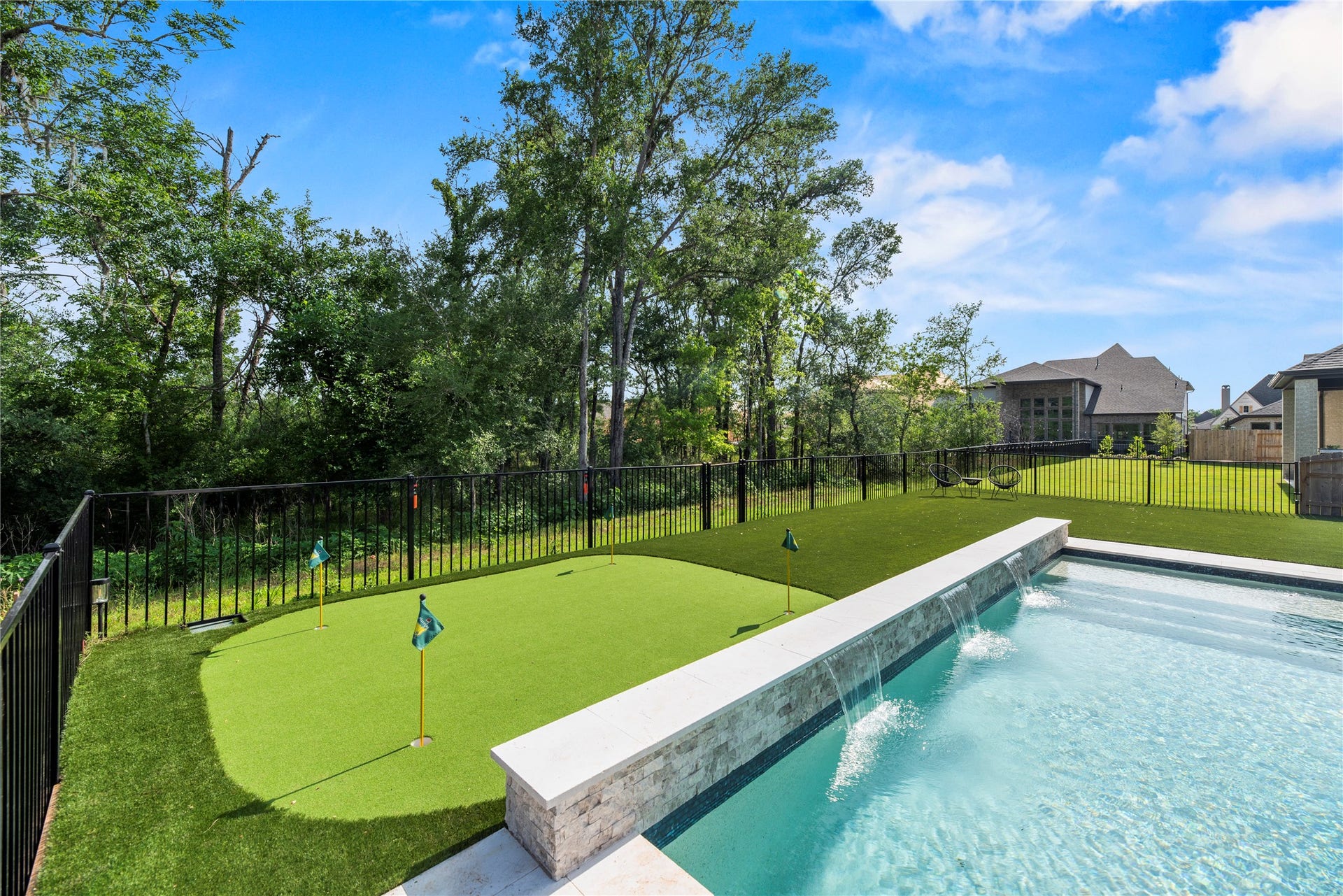4439 Southpoint Way, Fulshear, TX 77441 Your own putting green is behind the pool wall with water features.
