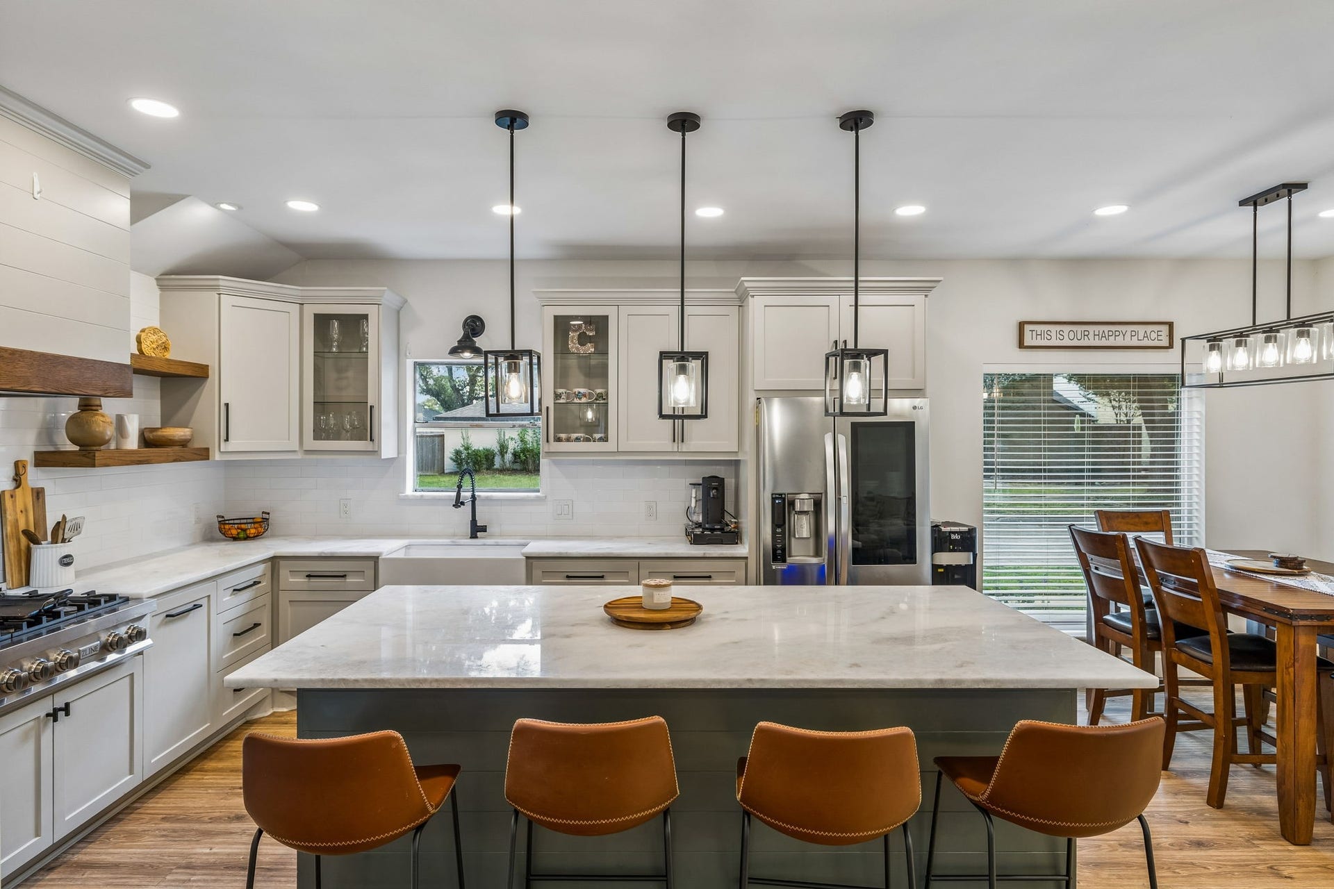 7803 Blackjack Court, Houston, TX 77088 Welcome to 7803 Blackjack! Modern kitchen with a large marble island, stylish pendant lighting, and ample cabinetry. Cozy dining area with natural light and a welcoming atmosphere.