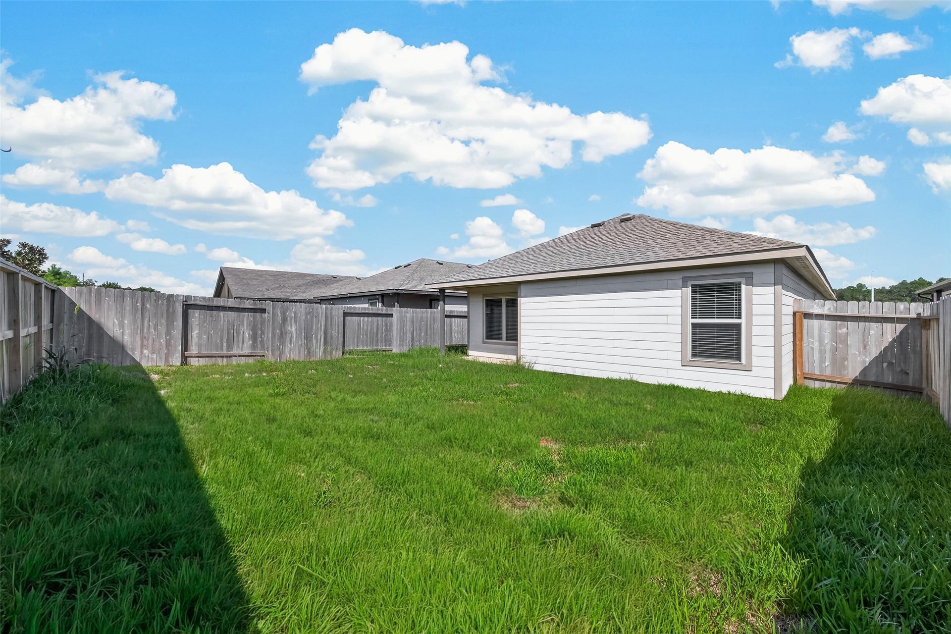 25471 Blue Mistflower Drive, Montgomery, TX 77316 Large backyard area ready for Swing set, trampoline, grills and other outdoor fun!!