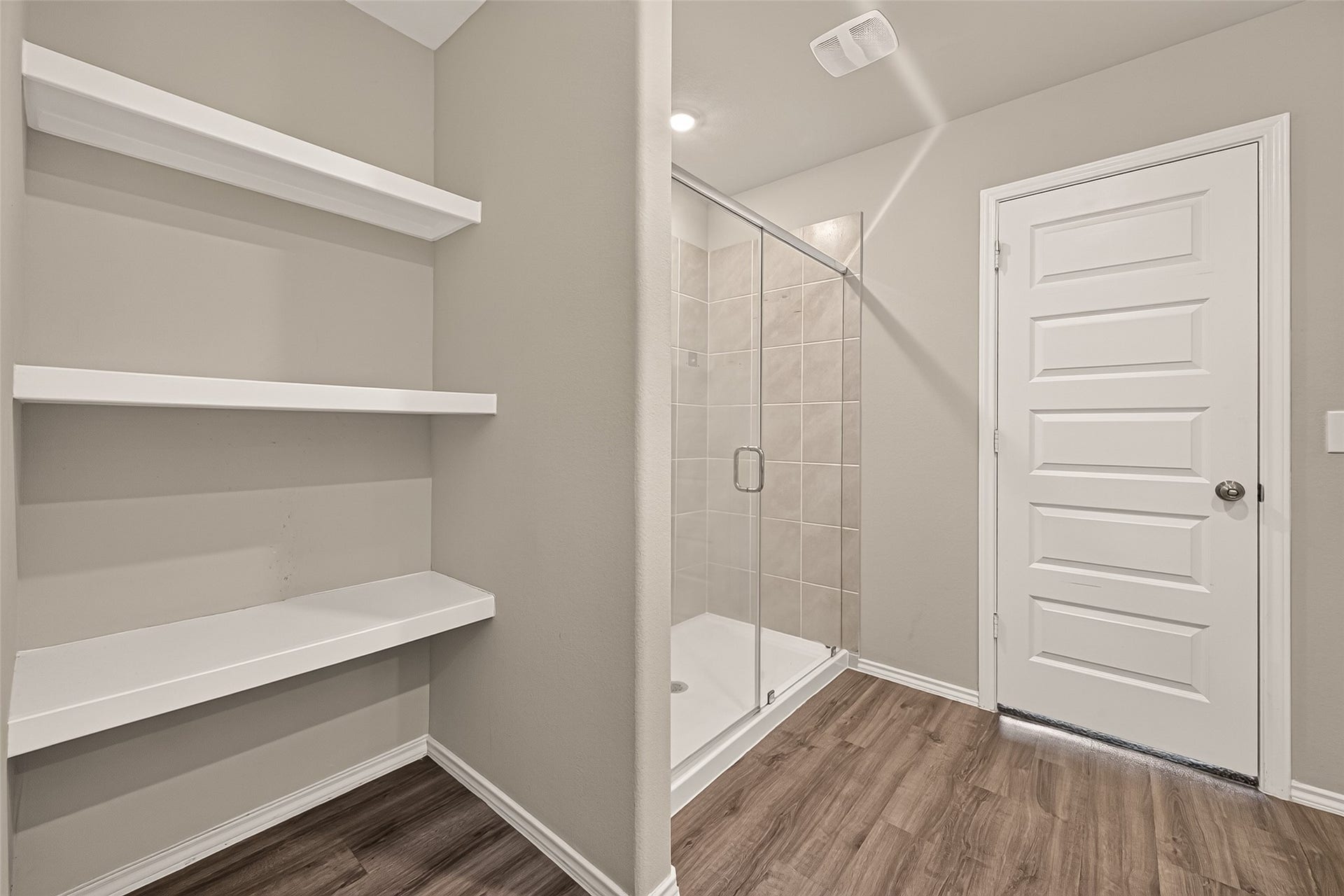 25471 Blue Mistflower Drive, Montgomery, TX 77316 Primary bathroom view from closet entrance looking toward shower and linen shelving