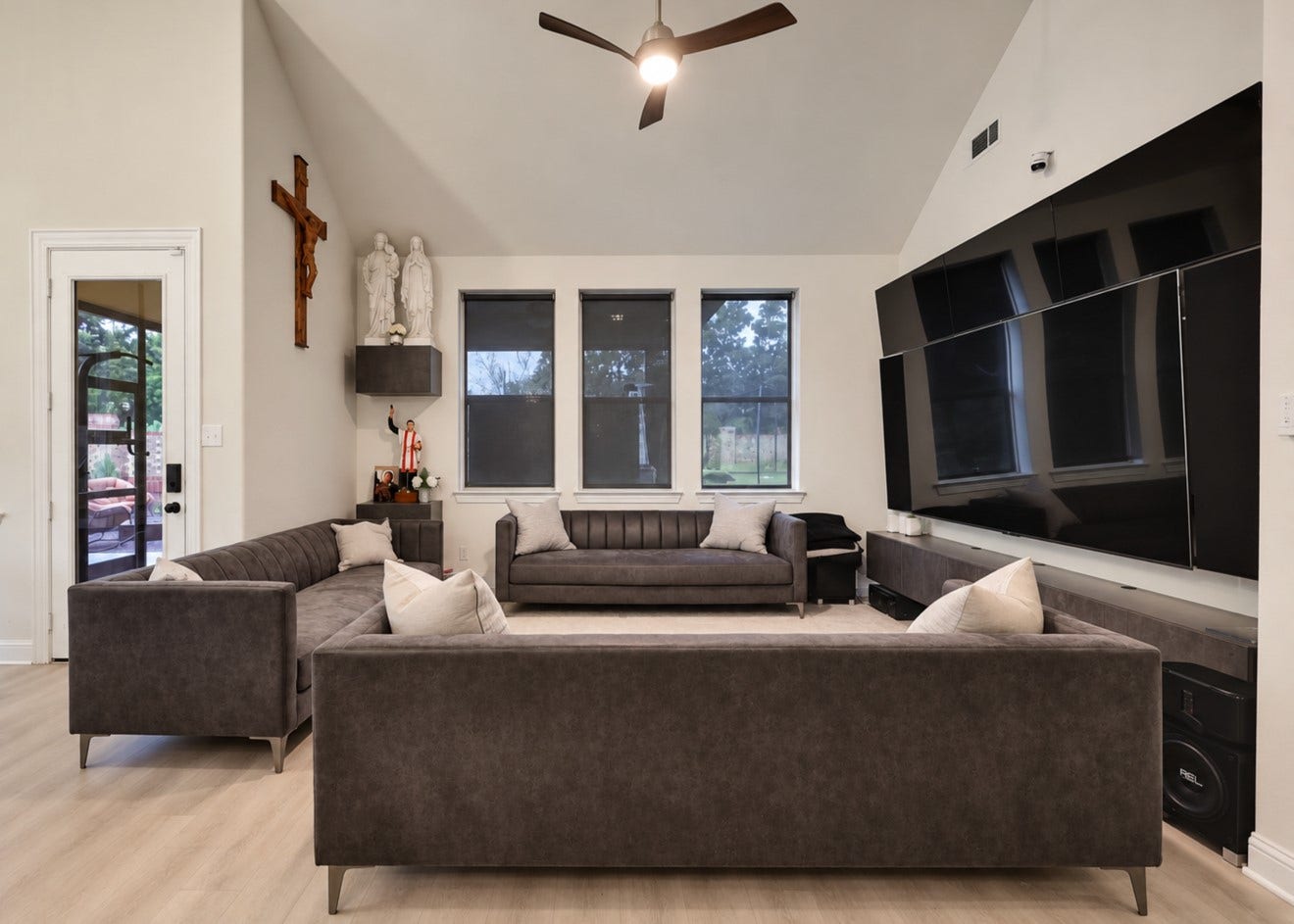2120 Rosenthal Lane, Houston, TX 77080 Inviting living area featuring high ceilings, updated flooring, and abundant natural light. The open layout connects to the kitchen and dining area for easy everyday living and entertaining, with convenient access to the staircase leading upstairs.