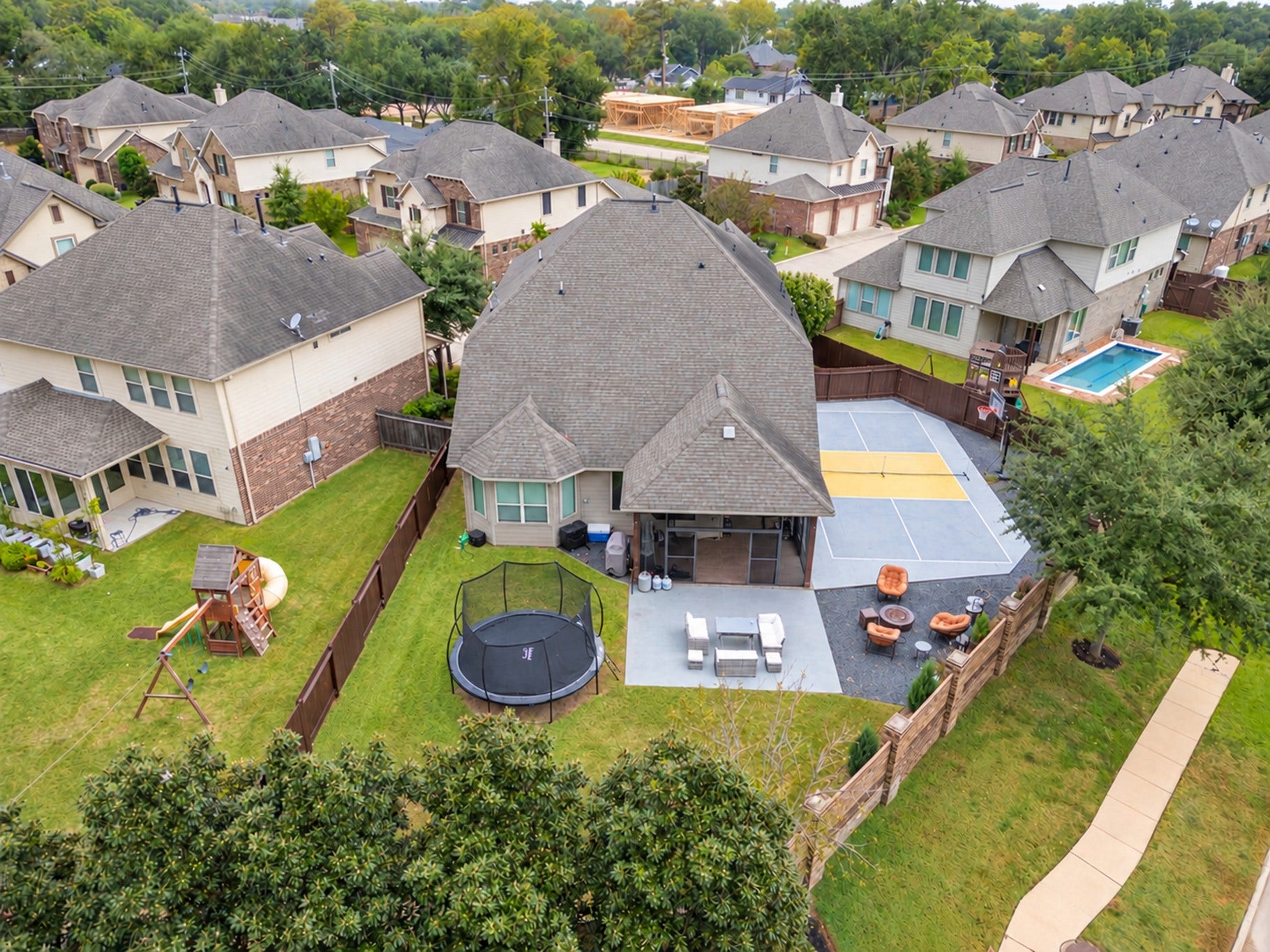 2120 Rosenthal Lane, Houston, TX 77080 Enjoy your own private recreation retreat in this spacious backyard, featuring a screened-in covered patio, a multipurpose pickleball or basketball court, an expanded patio, and plenty of green space for outdoor fun and entertaining!