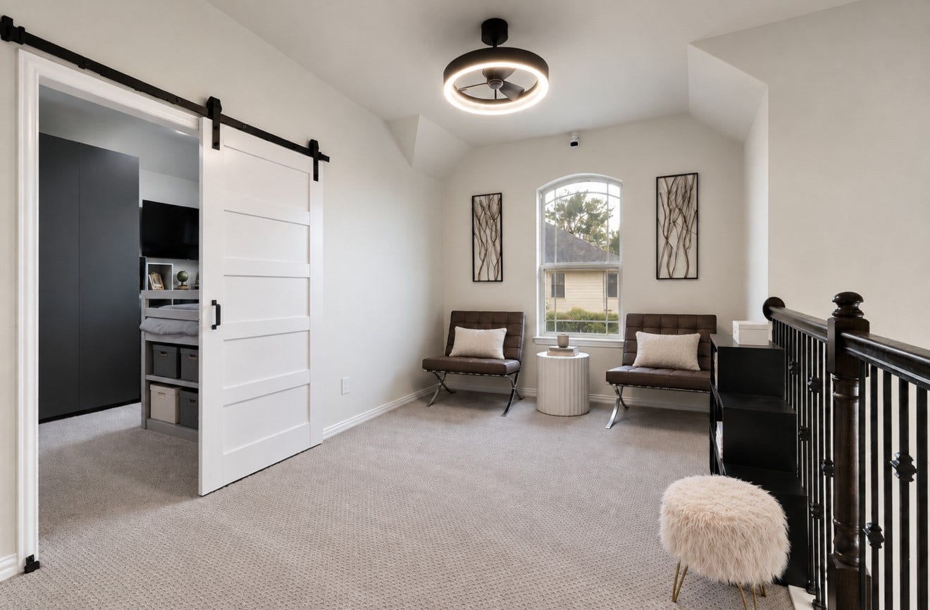2120 Rosenthal Lane, Houston, TX 77080 The upstairs staircase opens directly into a spacious game room, offering a versatile setting for recreation, relaxation, or entertaining. To the left, a separate office with a sliding door provides a dedicated space for work or study.