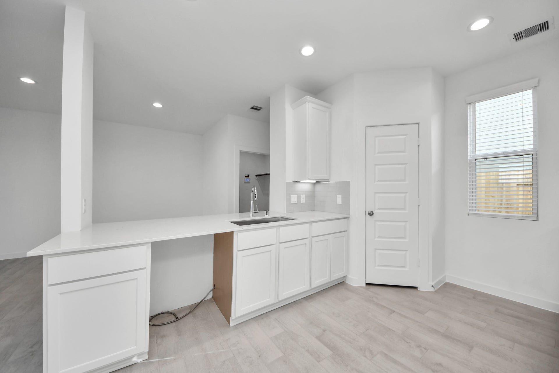 18551 Athena Flower Drive, Fresno, TX 77545 All of this overlooks your expansive family room, creating a perfect space for culinary delights and family gatherings. Sample photo of completed home with similar floor plan. Actual colors and selections may vary.