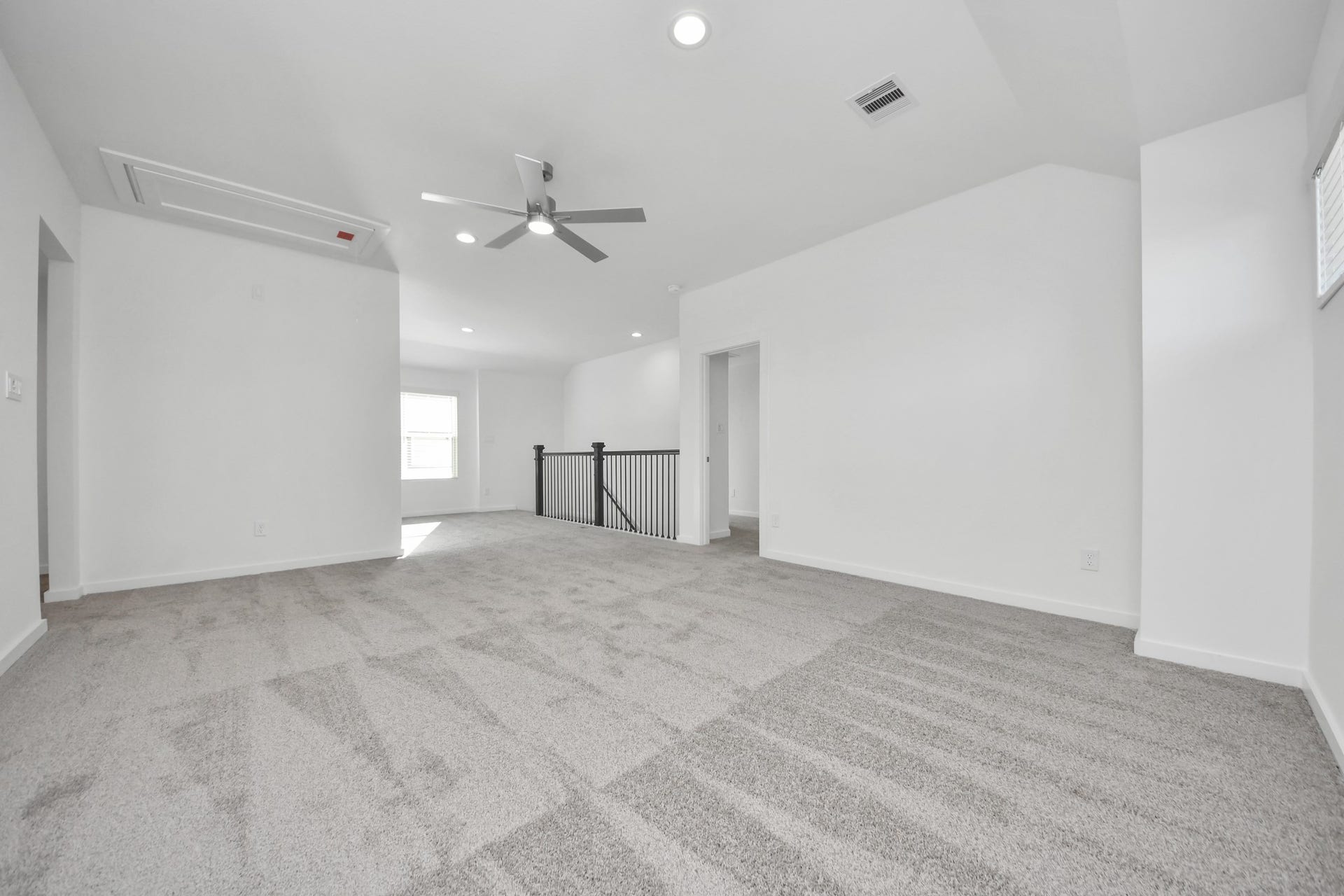 18551 Athena Flower Drive, Fresno, TX 77545 Come upstairs and relish a day of relaxation in this loft area! Ideal as an additional living space or game room, it boasts plush carpeting, high ceilings, custom paint, and windows that flood the area with abundant natural light. Sample photo of completed home with similar floor plan. Actual colors and selections may vary.