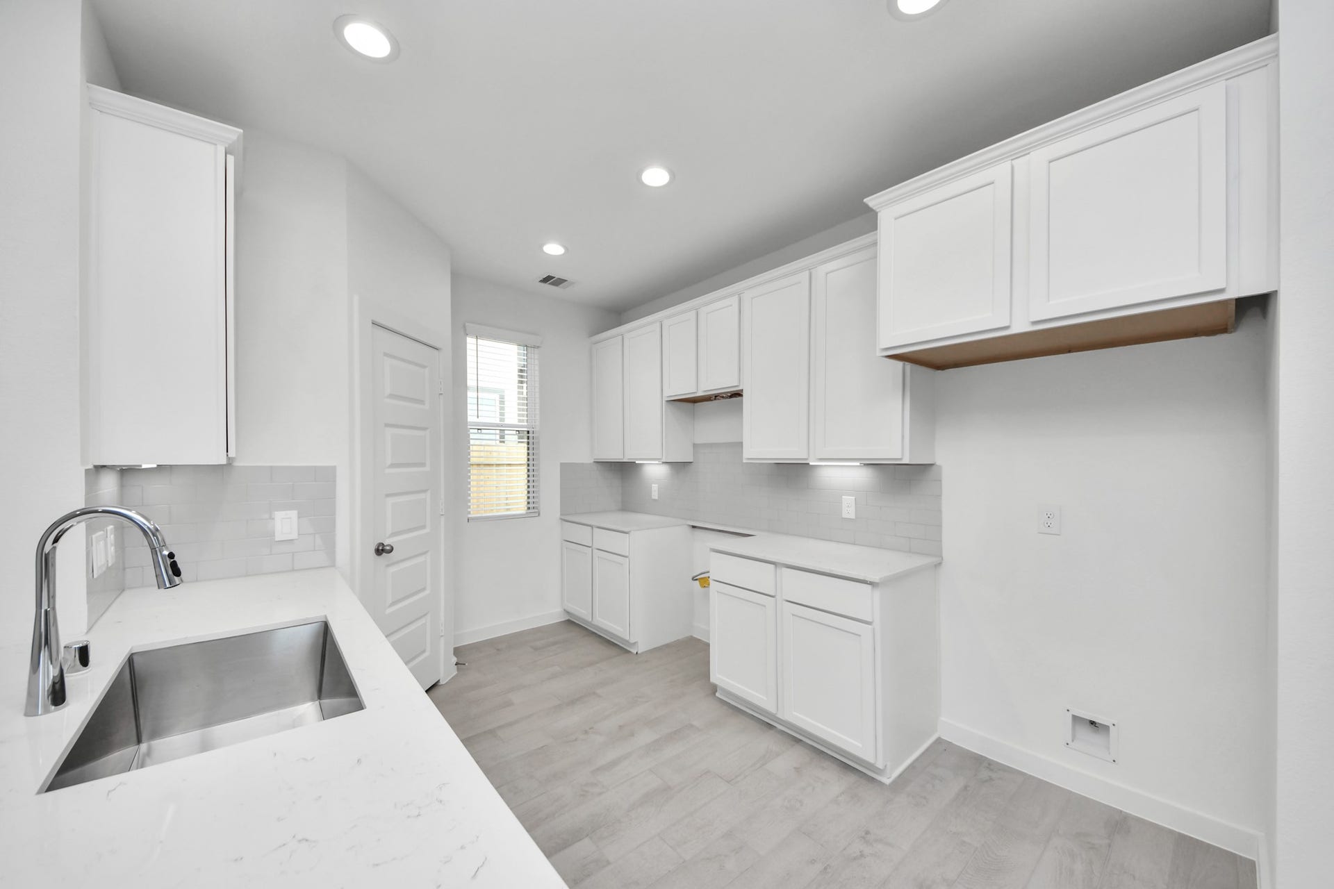 18551 Athena Flower Drive, Fresno, TX 77545 The extended counter area adds both practicality and style, making meal preparation a breeze. Every detail is thoughtfully designed to enhance the kitchen's functionality and aesthetic appeal. Sample photo of completed home with similar floor plan. Actual colors and selections may vary.