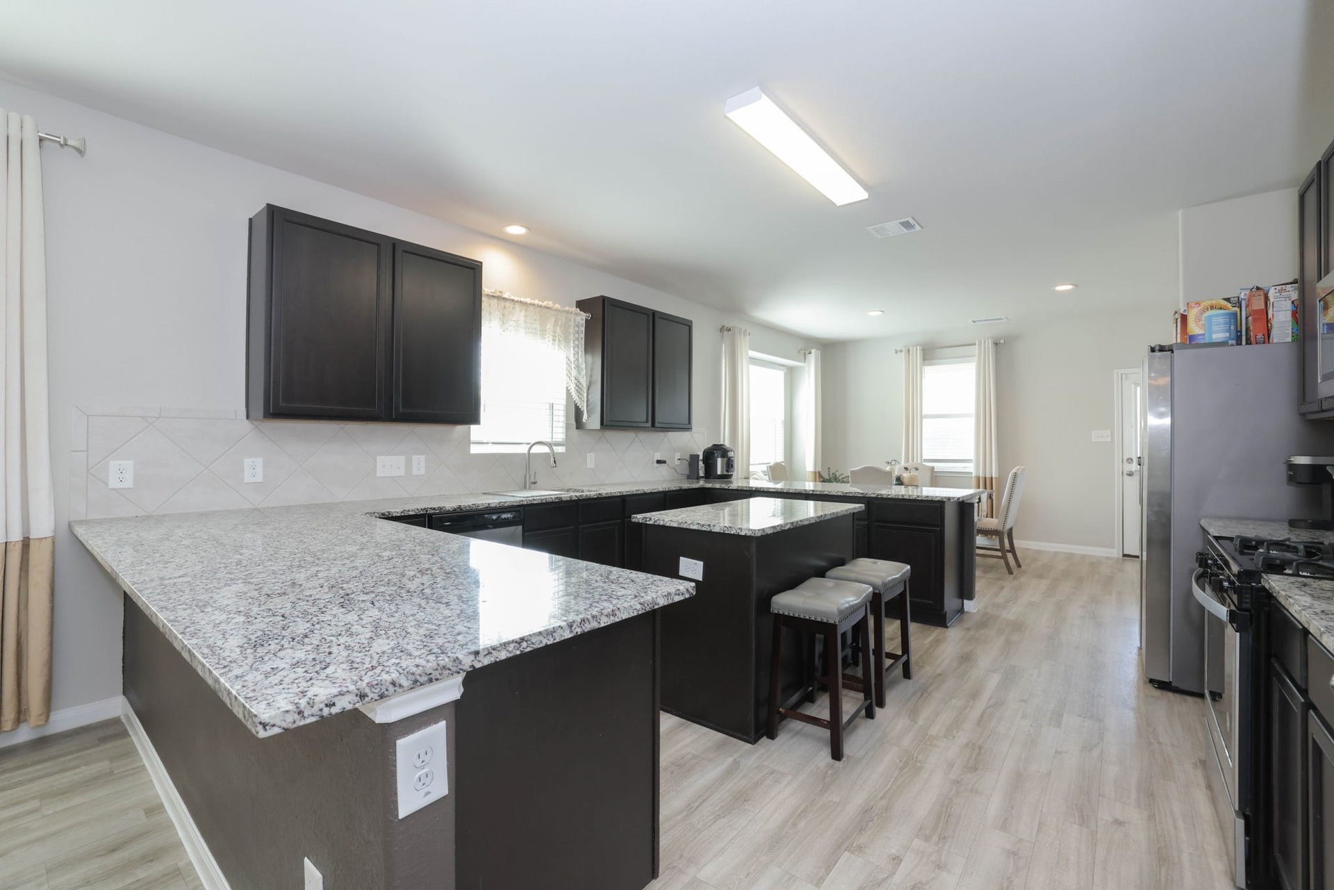 3596 Cannon Drive, Conroe, TX 77301 Spacious kitchen with an island.