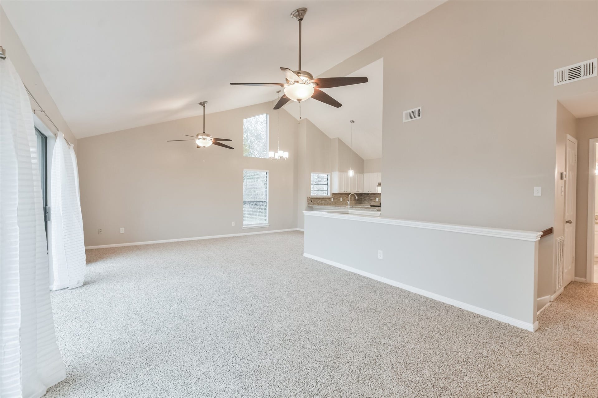 The open floorplan and tall ceilings create a feeling a spaciousness.