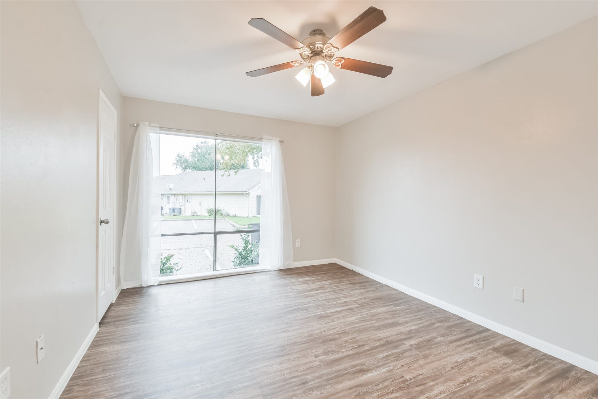 Second first floor bedroom.  Ceiling fans are throughout the home and bedrooms for added energy efficiency and comfort.