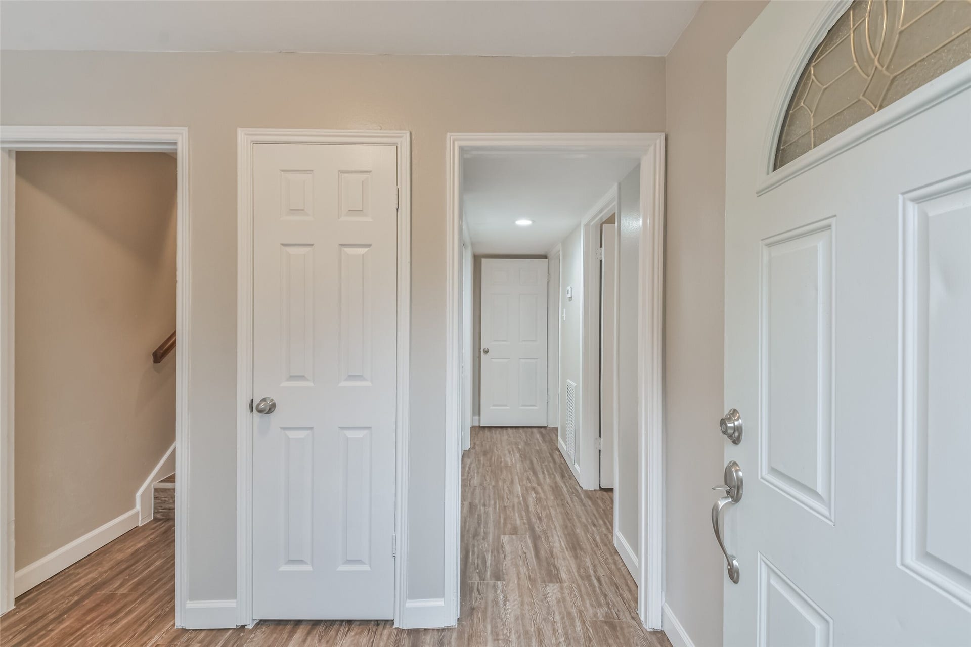 The main entrance leads to all bedrooms down and the main living area upstairs.