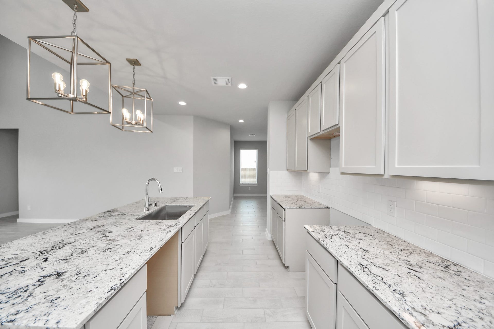 11115 Tulip Ridge Trail, Houston, TX 77044 The extended counter area adds both practicality and style, making meal preparation a breeze. Every detail is thoughtfully designed to enhance the kitchen's functionality and aesthetic appeal. Sample photo of completed home with similar floor plan. Actual colors and selections may vary.