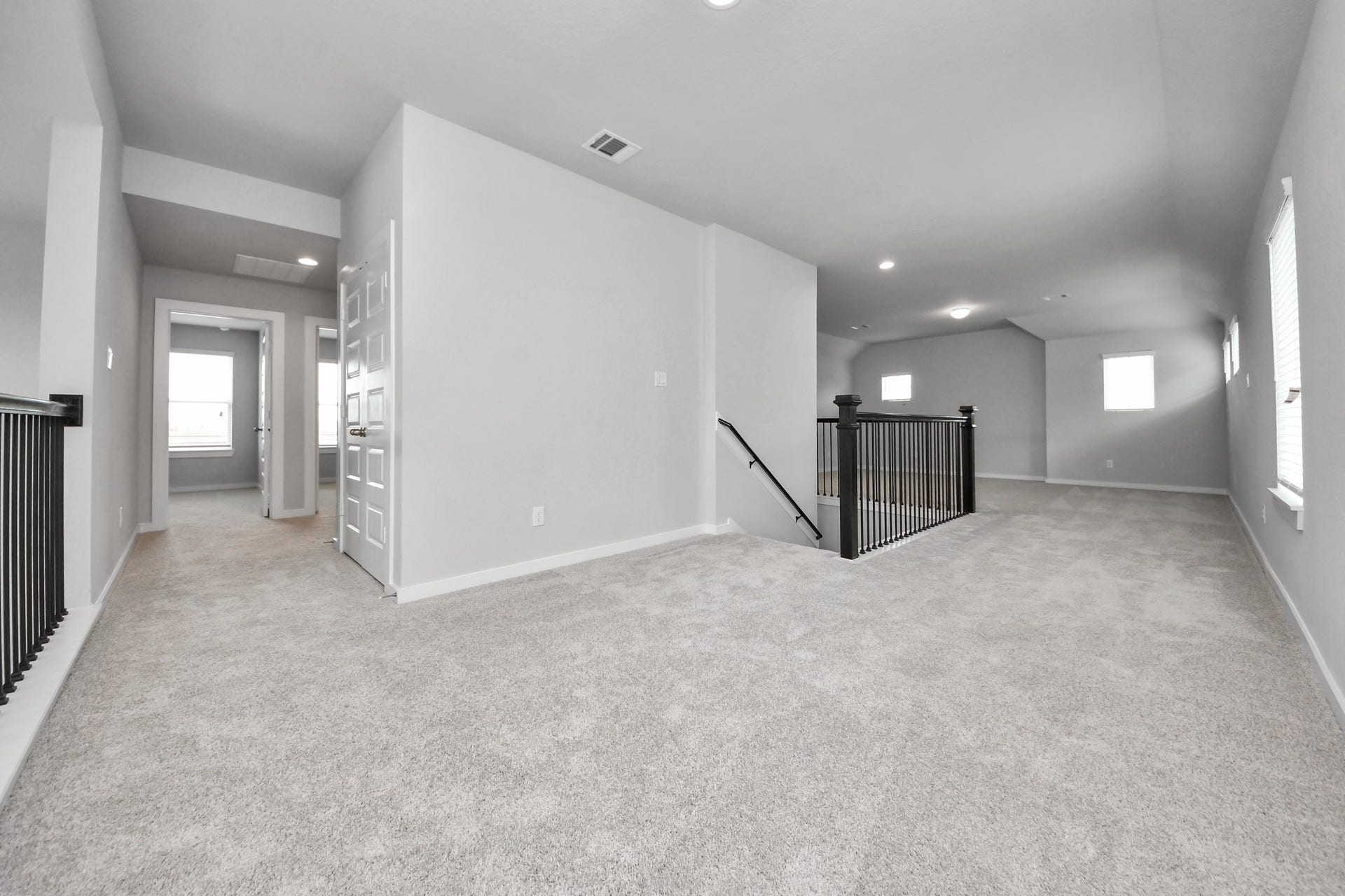 11115 Tulip Ridge Trail, Houston, TX 77044 Come upstairs and enjoy a day of leisure in this fabulous game room! This is the perfect hangout spot or adult game room! Features plush carpet, high ceilings, custom paint and windows for plenty of natural light. Sample photo of completed home with similar floor plan. Actual colors and selections may vary.